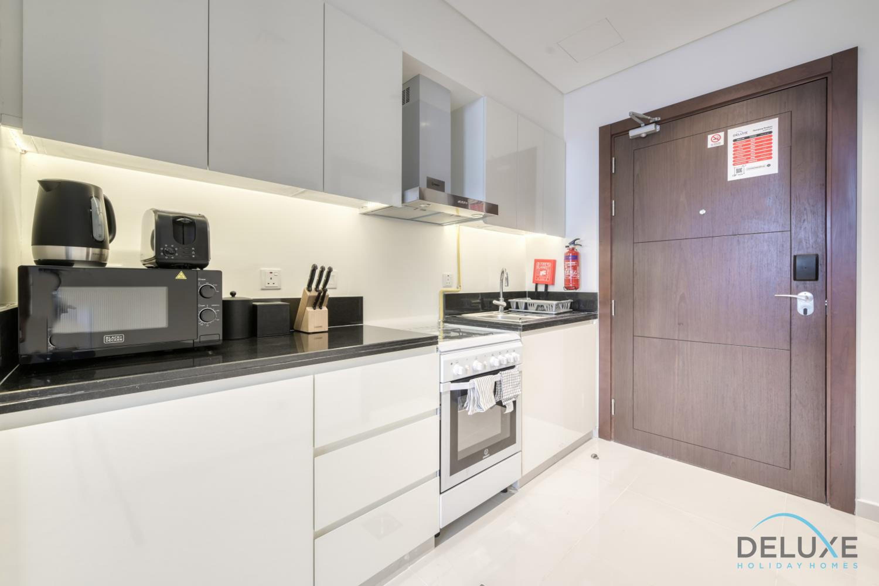 Sunlit Studio at Golf Promenade 2A DAMAC Hills By Deluxe Holiday Homes
