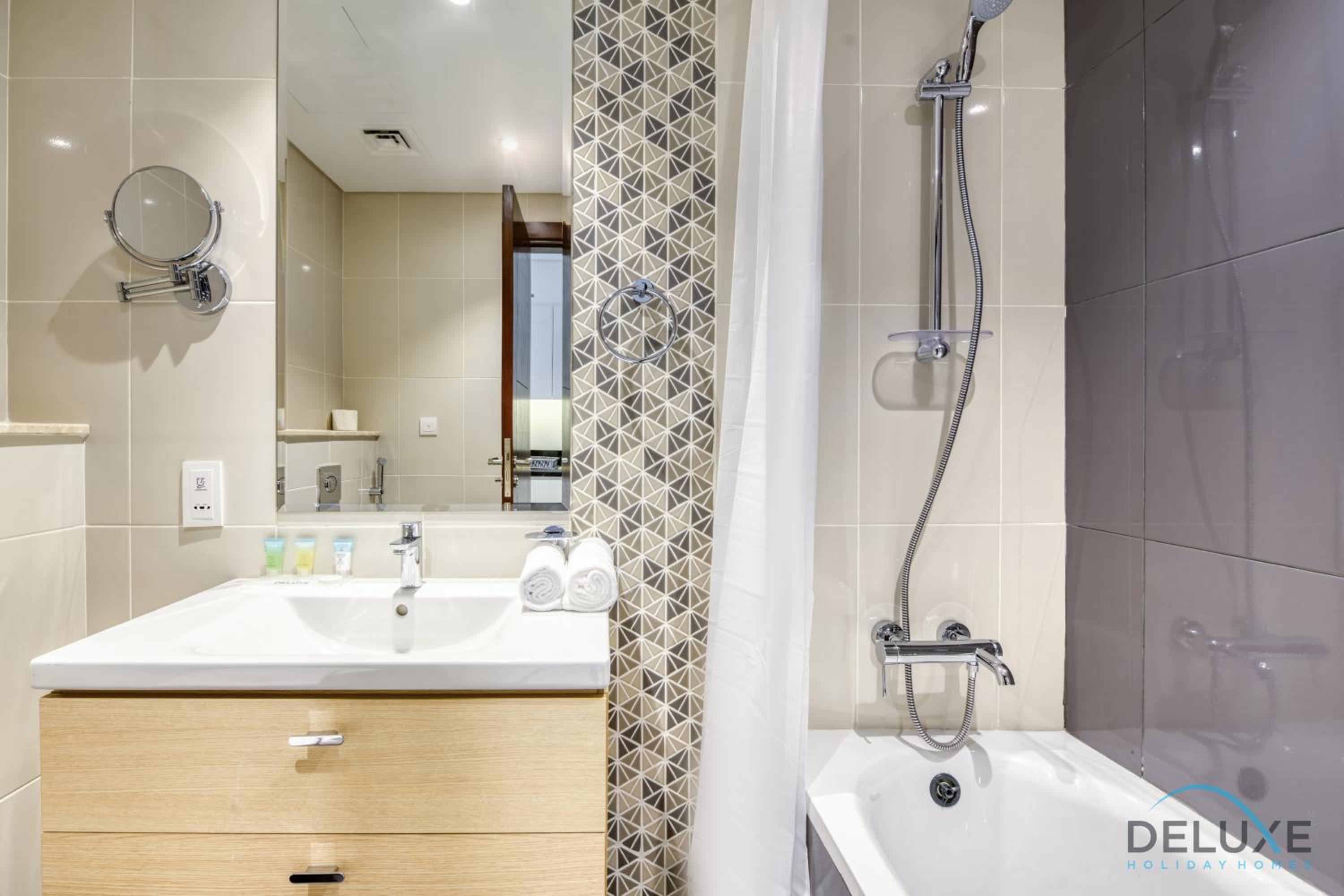 Sunlit Studio at Golf Promenade 2A DAMAC Hills By Deluxe Holiday Homes