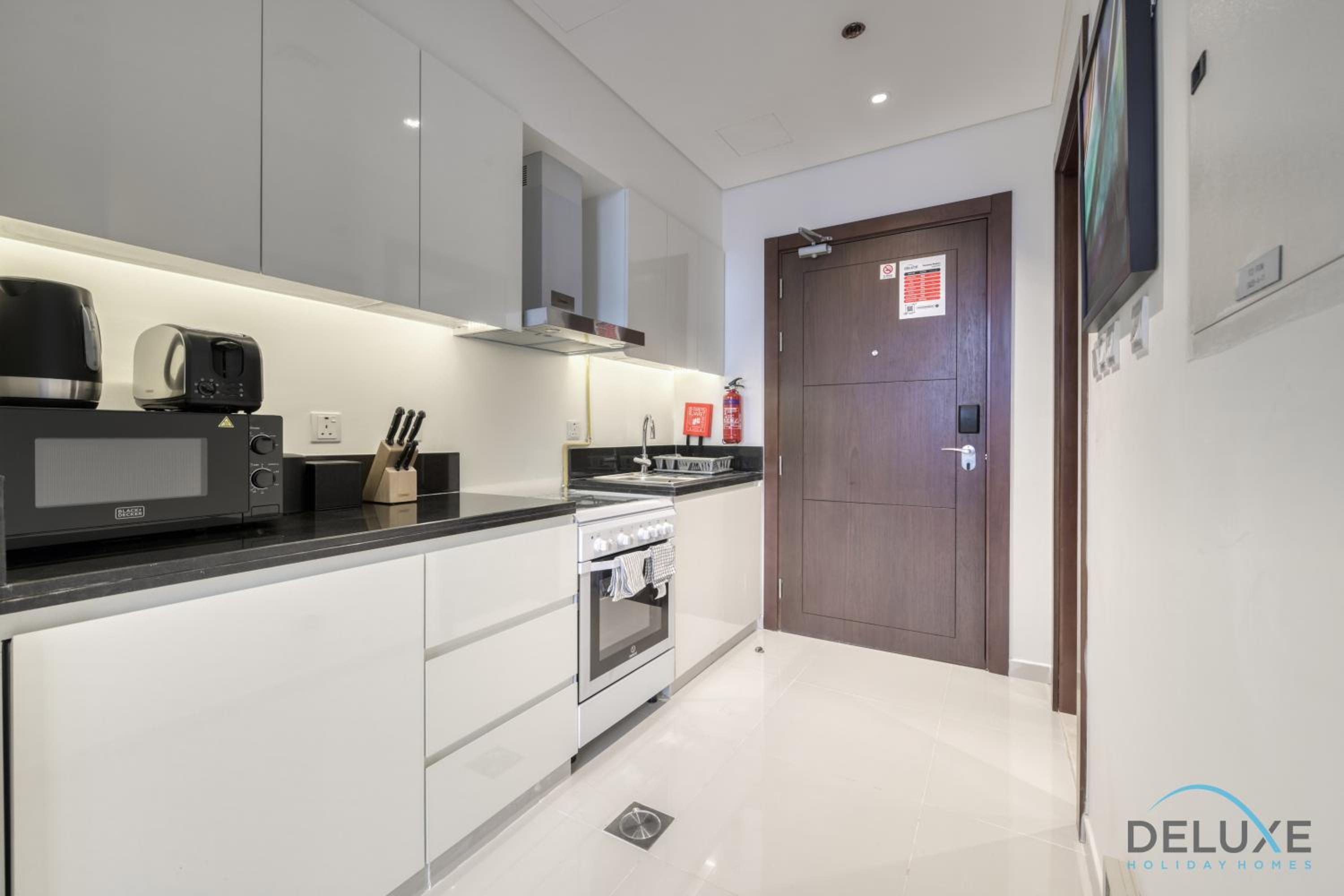 Sunlit Studio at Golf Promenade 2A DAMAC Hills By Deluxe Holiday Homes