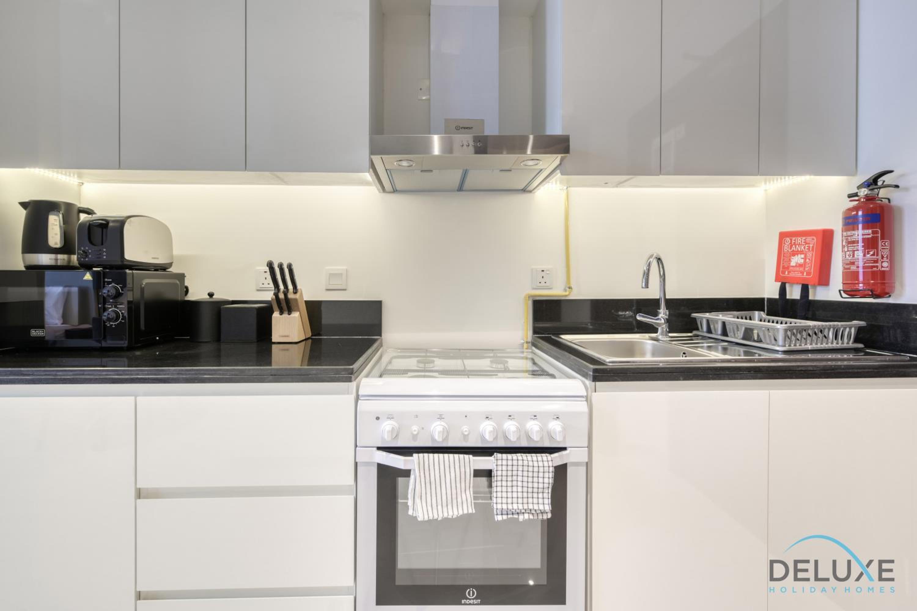 Sunlit Studio at Golf Promenade 2A DAMAC Hills By Deluxe Holiday Homes