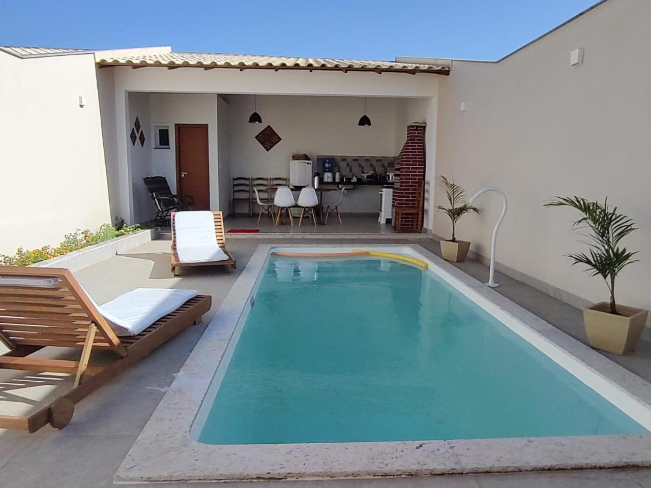 Ivana Imoveis - Casa com Piscina na Praia do Morro á 2 minutos da praia