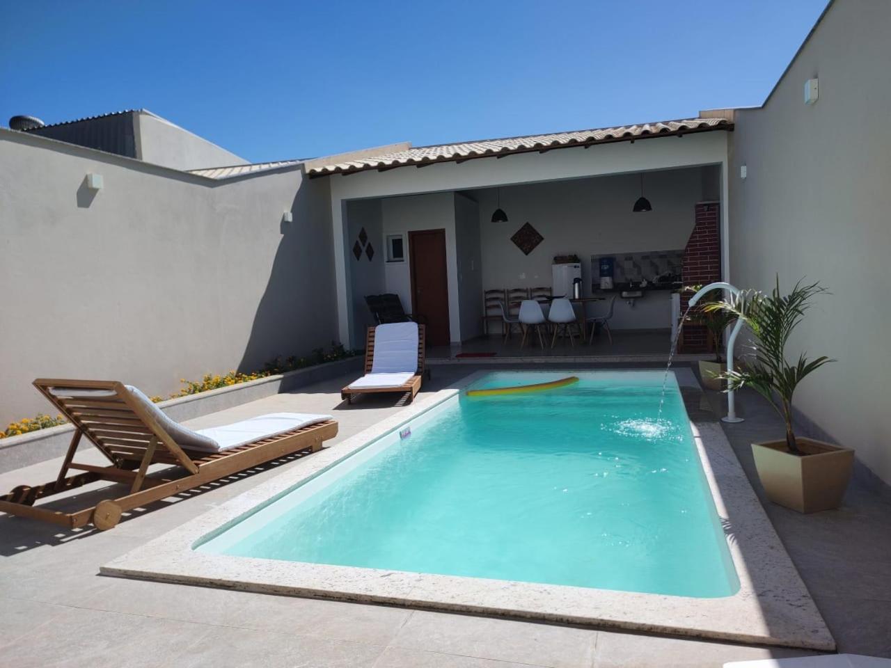Ivana Imoveis - Casa com Piscina na Praia do Morro á 2 minutos da praia