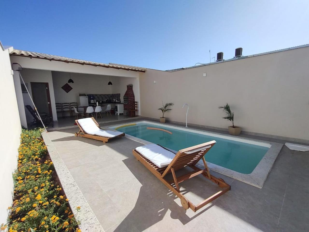 Ivana Imoveis - Casa com Piscina na Praia do Morro á 2 minutos da praia