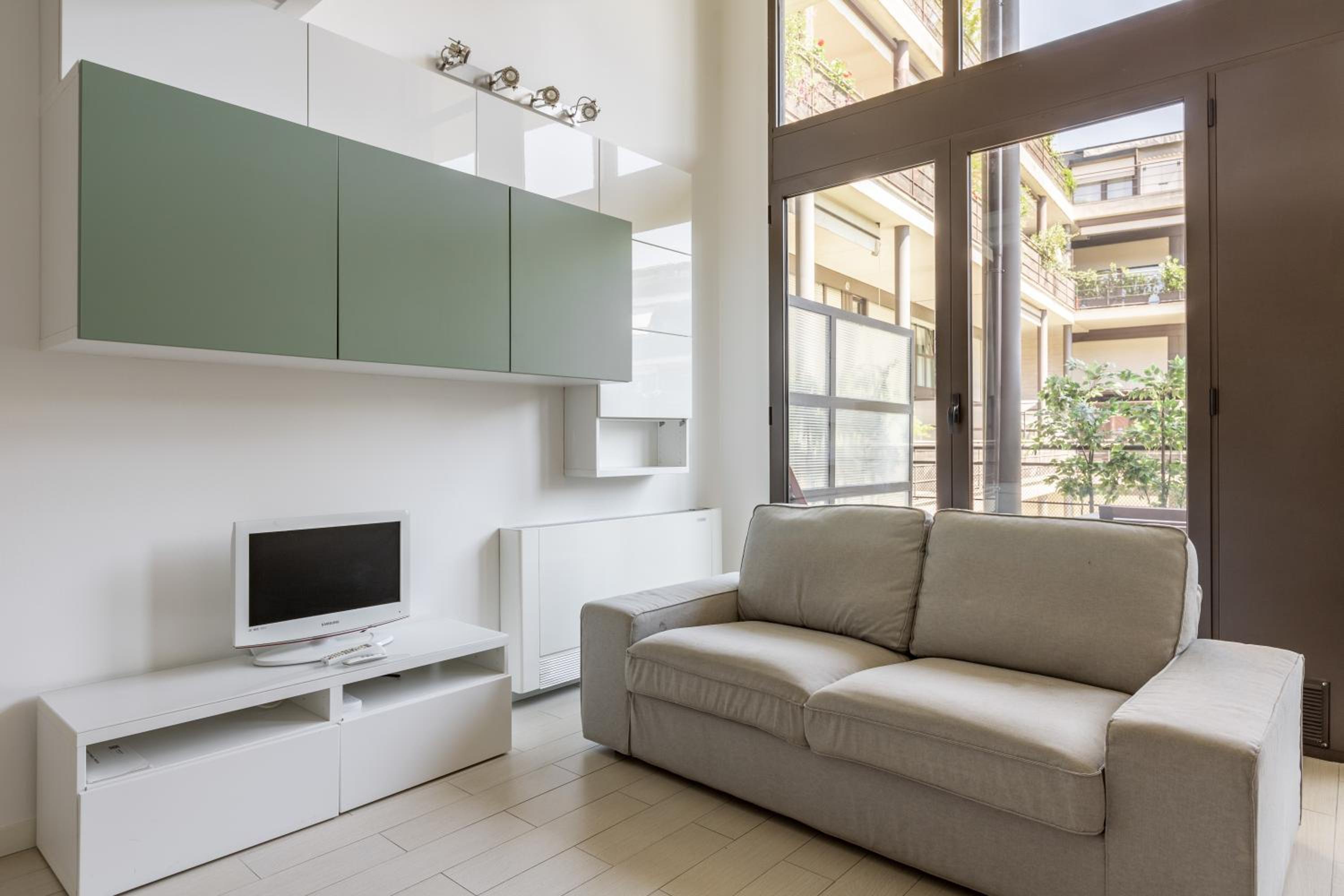 GuestHost - Elegant Loft with Balcony!
