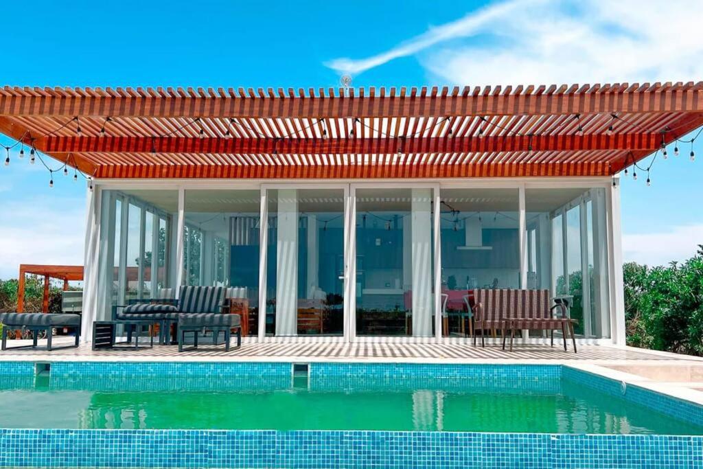 HOP BUZIOS exclusiva oasis y playa en Chincha