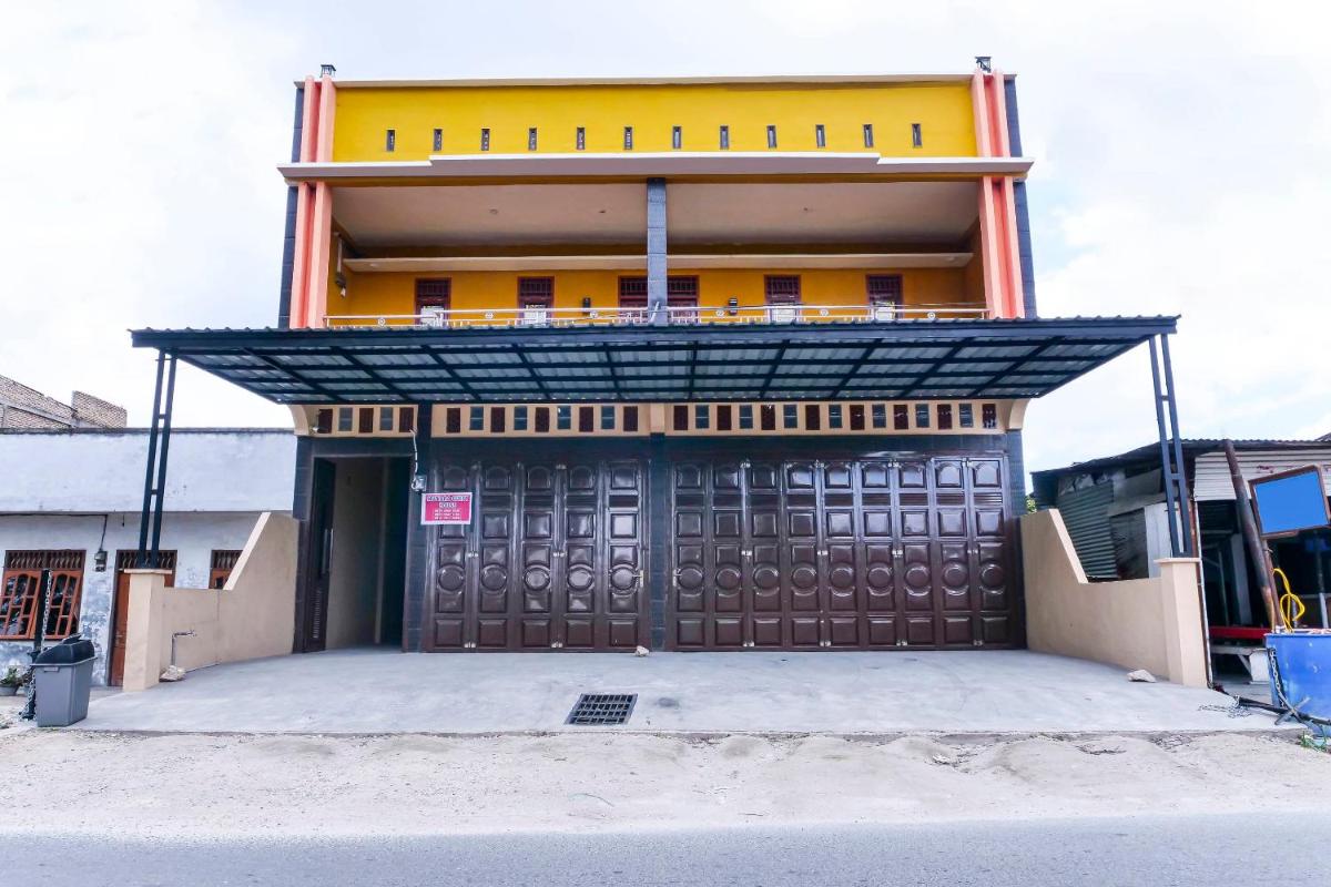 Hotel OYO 91223 Mutiara Guest House - Image 1