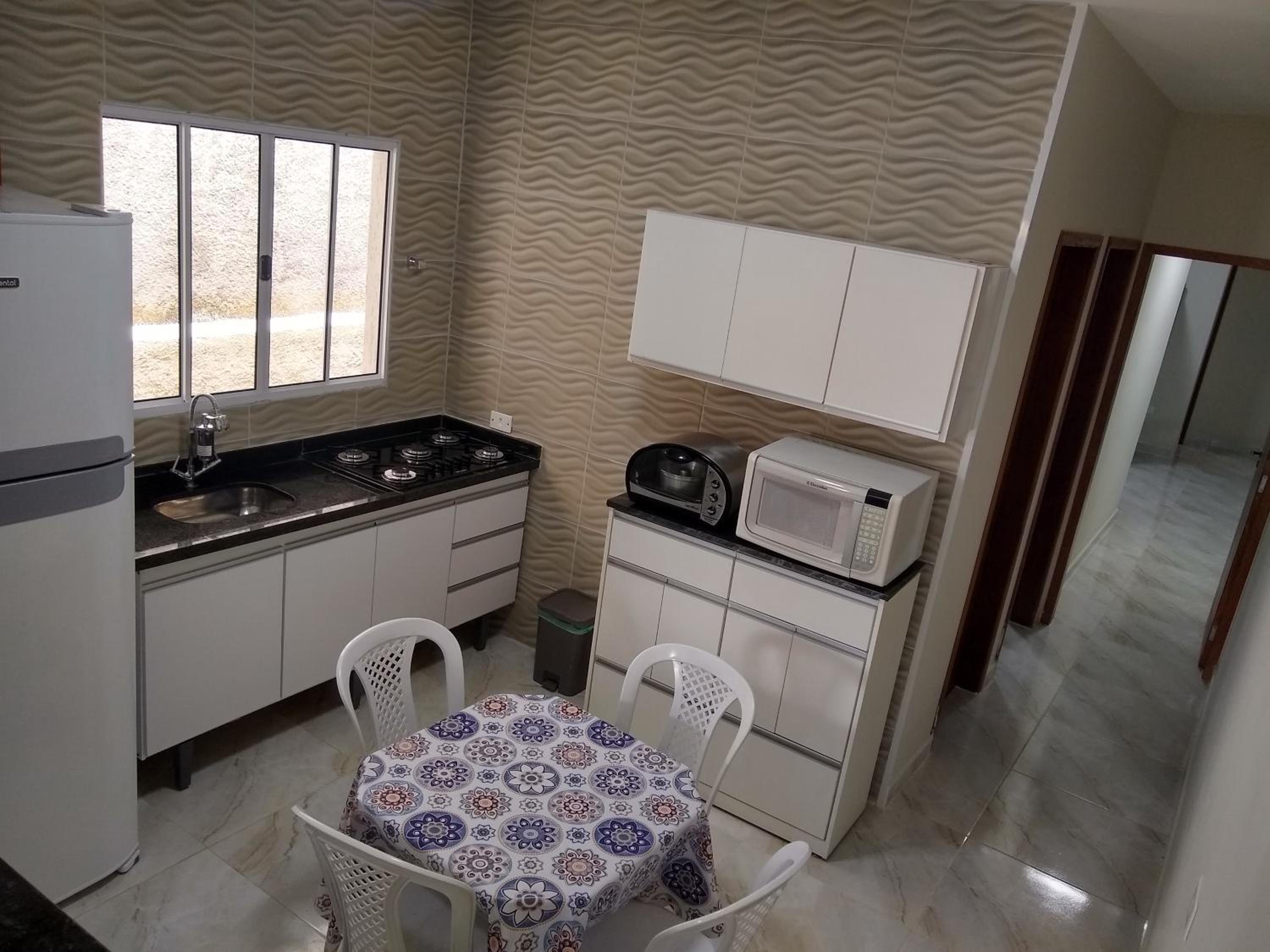 A Casa Linda Com Piscina Aquecida churrasqueira wifi pertinho da praia em Itanhaém
