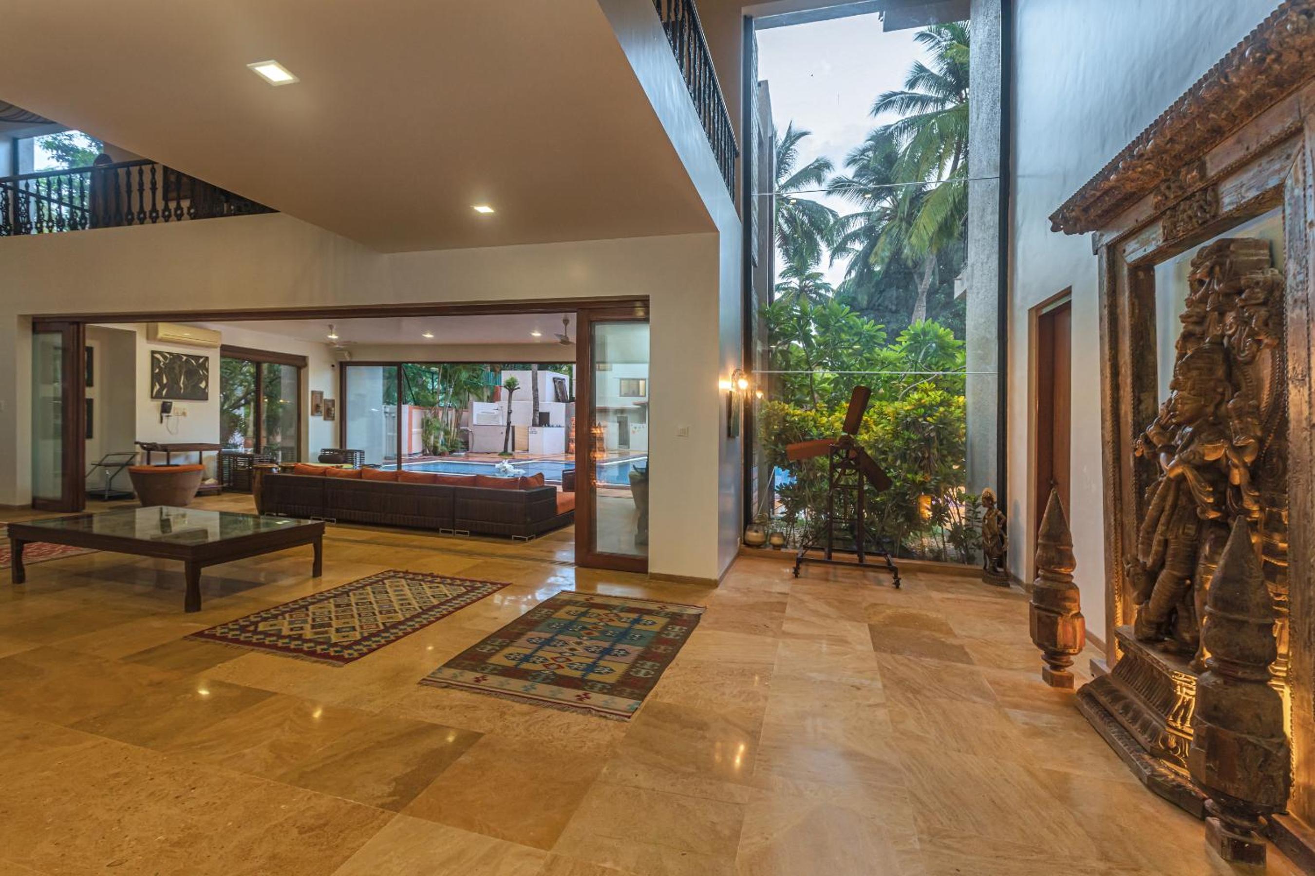 SaffronStays Casa Del Palms - 8BR luxury pool villa with gazebo, pickleball, bar & lawns near Nagaon Beach view 4