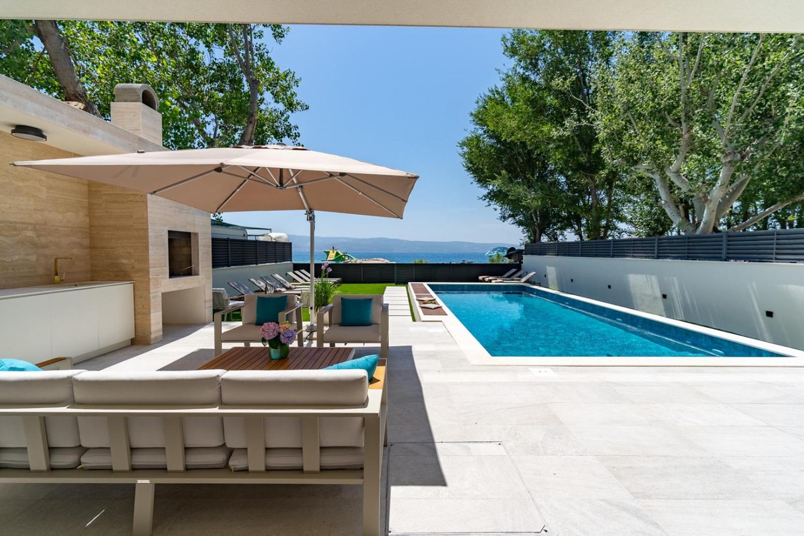 Beachfront Villa Erce with private 40sqm heated pool, a Gym, 7 en-suite bedrooms, a rooftop terrace, 2 living areas view 4
