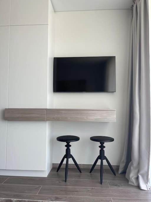 SUNNY studio w balcony and heated pool in Mano Jūra 2