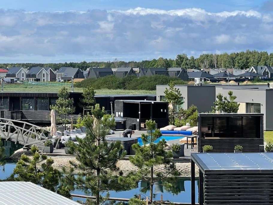 SUNNY studio w balcony and heated pool in Mano Jūra 2
