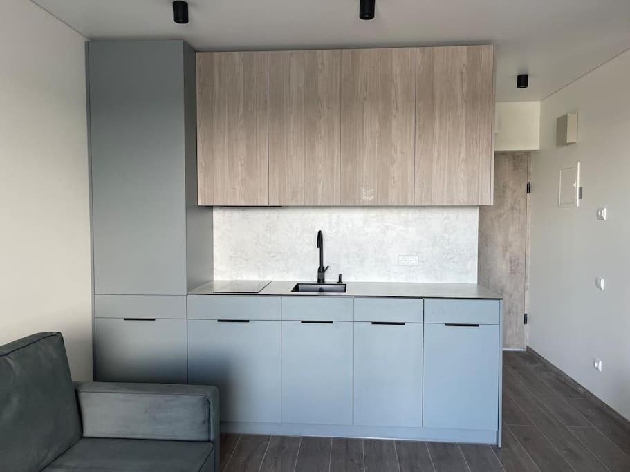 SUNNY studio w balcony and heated pool in Mano Jūra 2