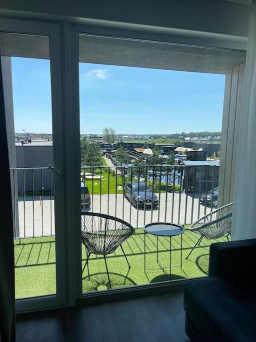 SUNNY studio w balcony and heated pool in Mano Jūra 2