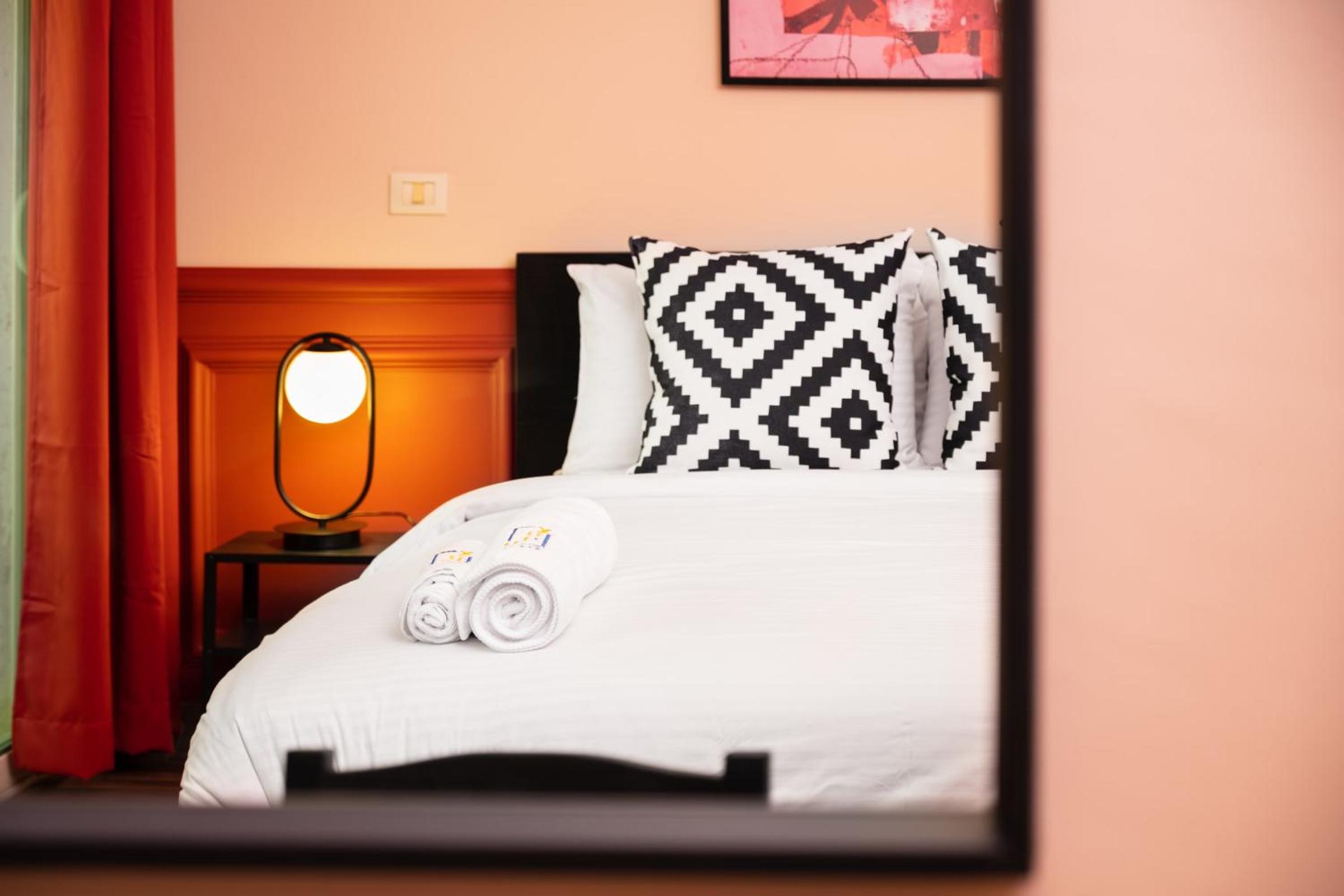 Distinct & Decent 2 BDR Apt Steps From Nightlife and Airport