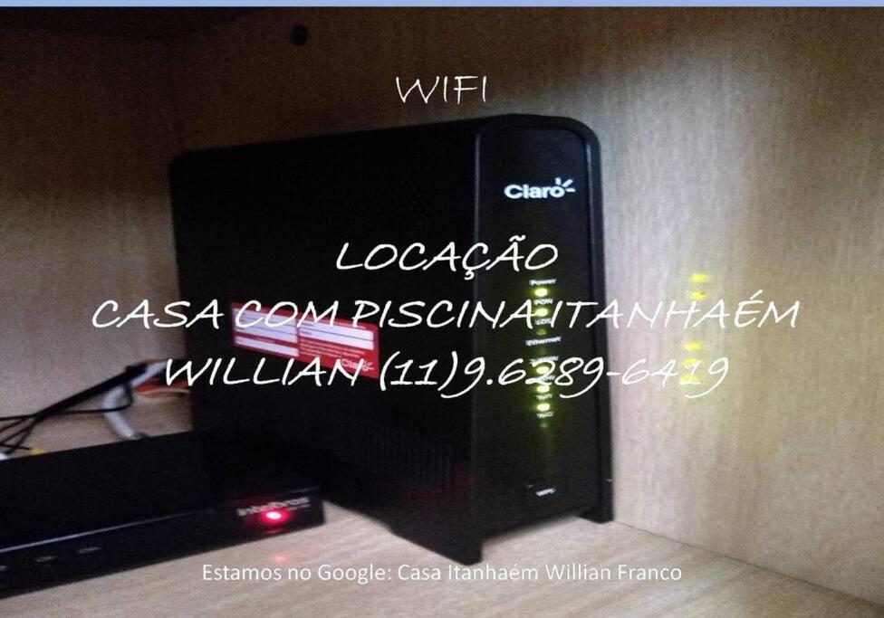 A Casa Linda Com Piscina Aquecida churrasqueira wifi pertinho da praia em Itanhaém
