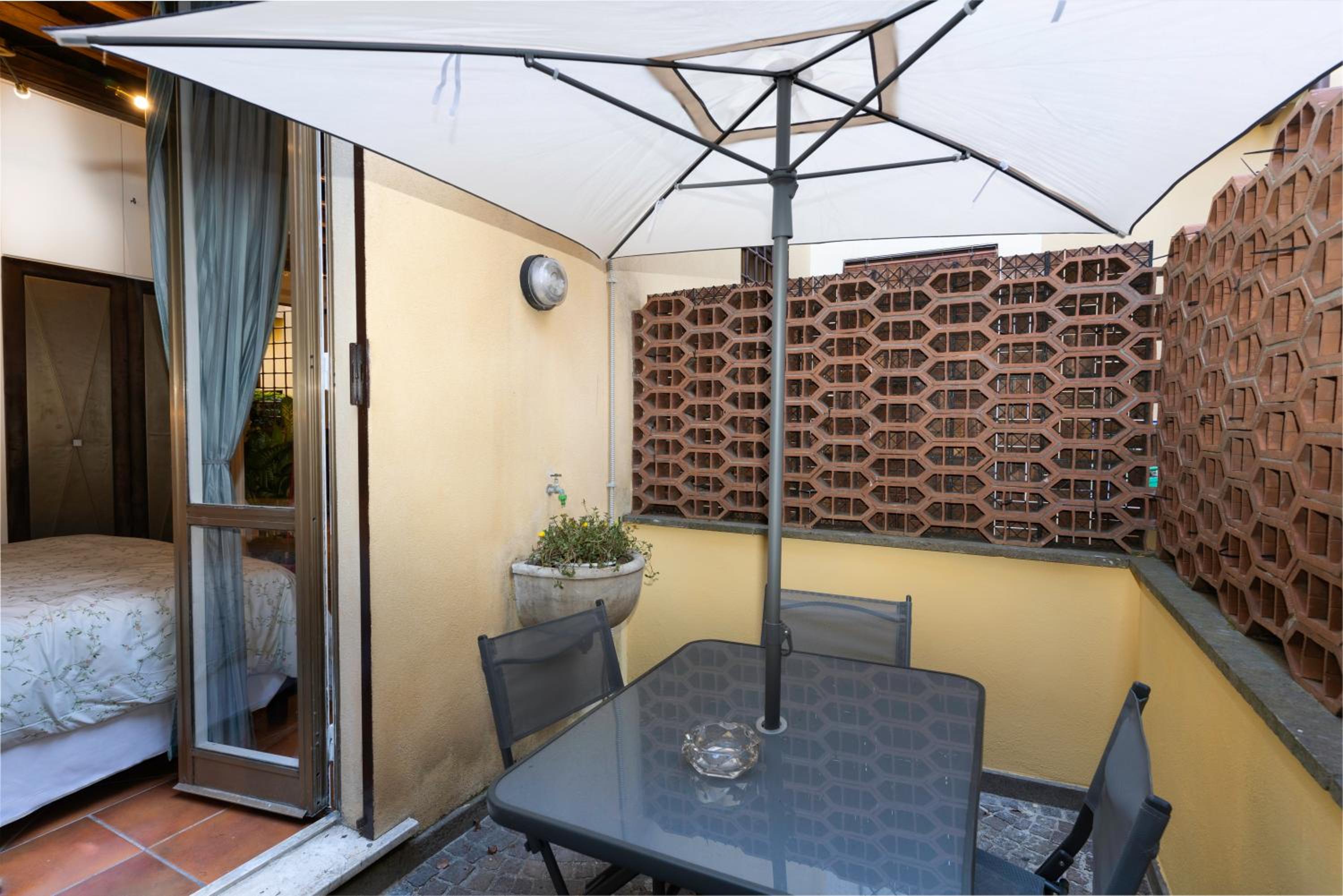 Quiet Trevi Fountain Apartment with patio and backyard