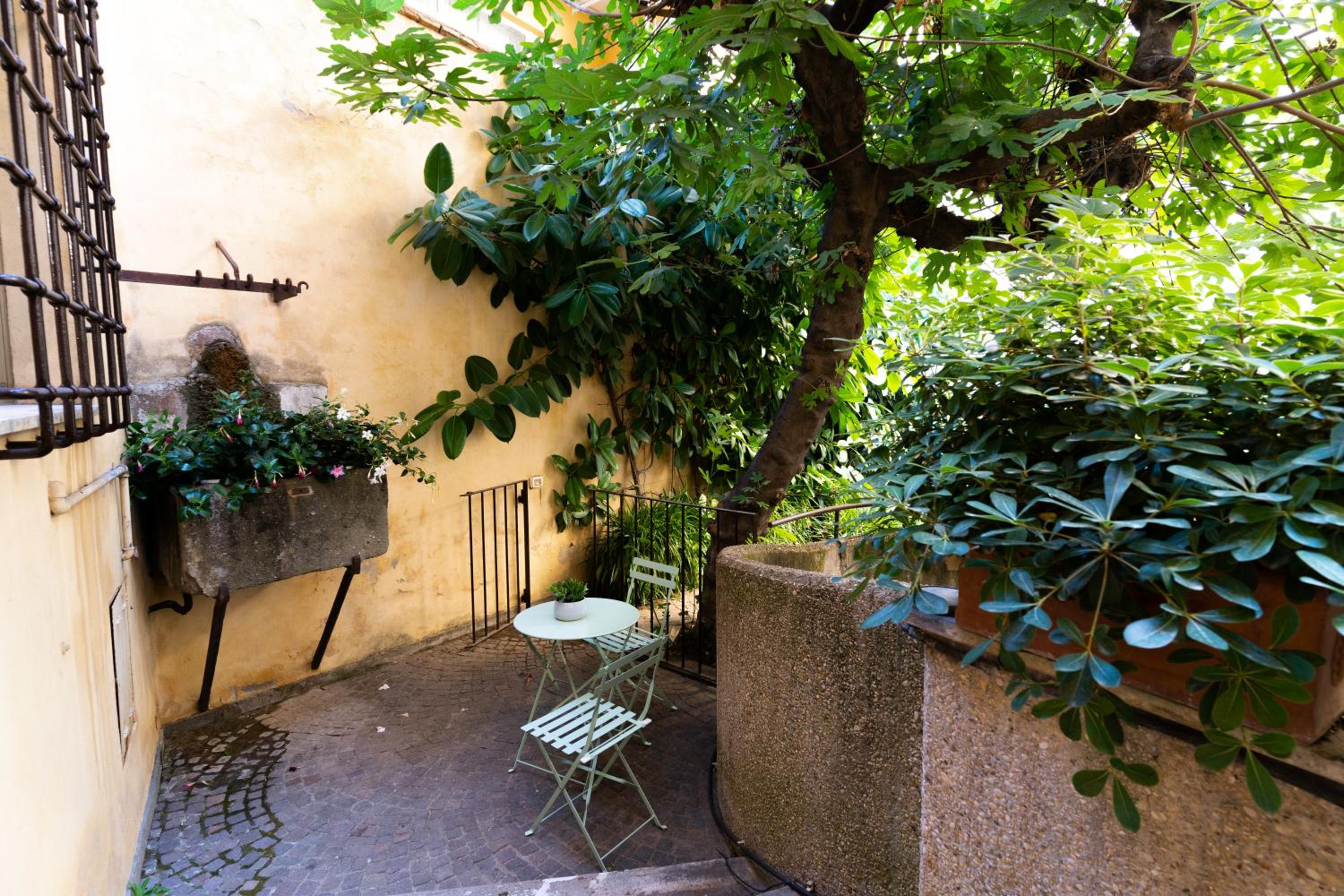 Quiet Trevi Fountain Apartment with patio and backyard