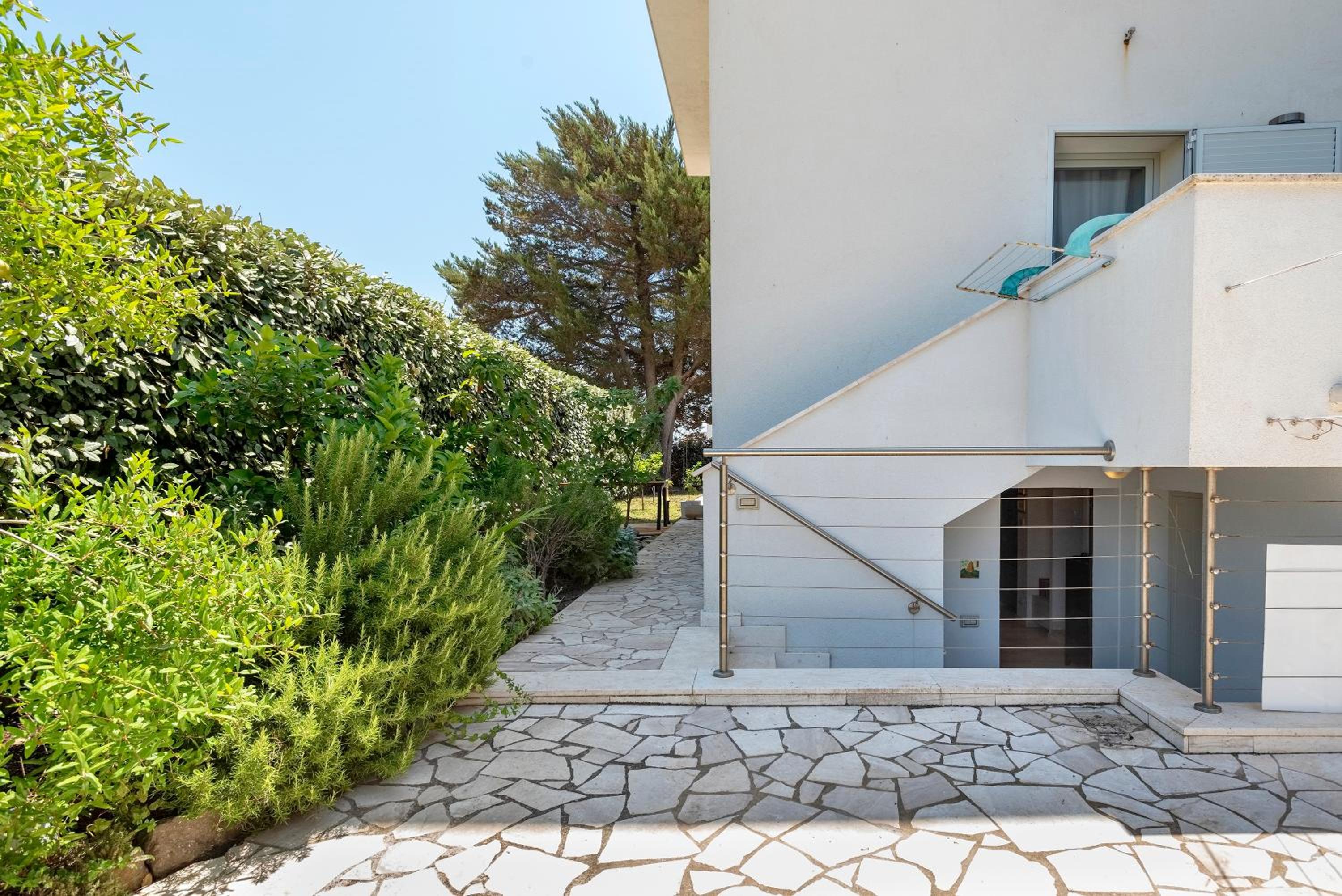 Charming Seafront Apartment with garden and patio