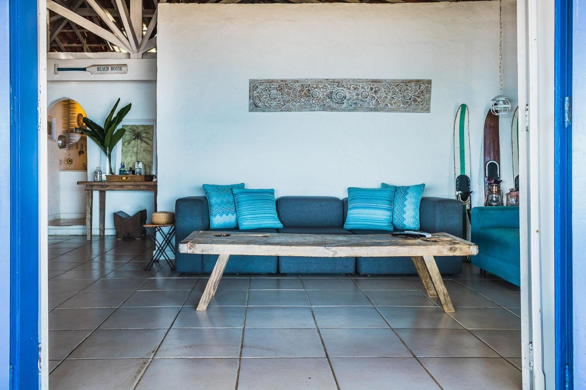 Casa pé na areia com varanda na Praia da Armação