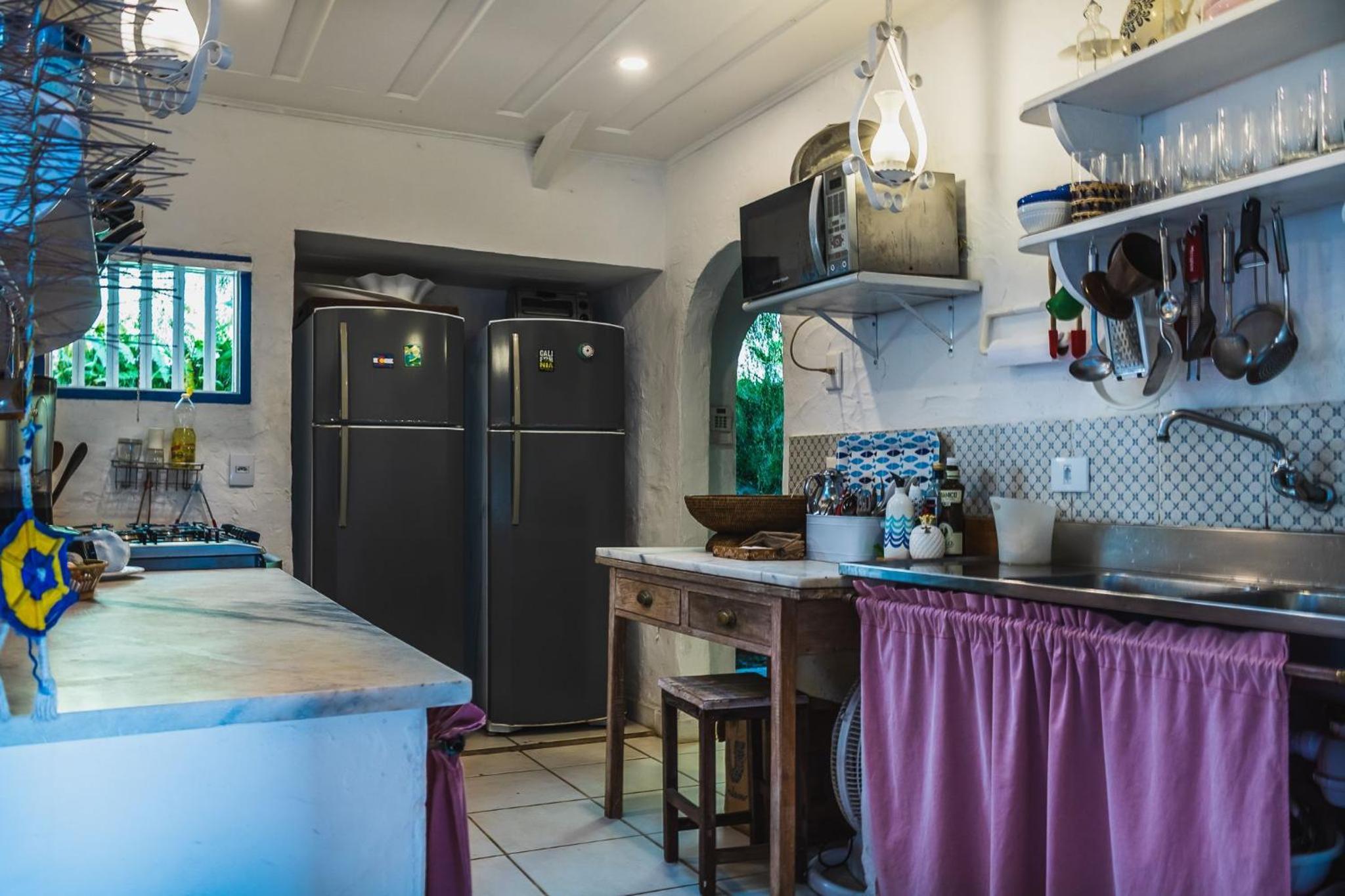 Casa pé na areia com varanda na Praia da Armação