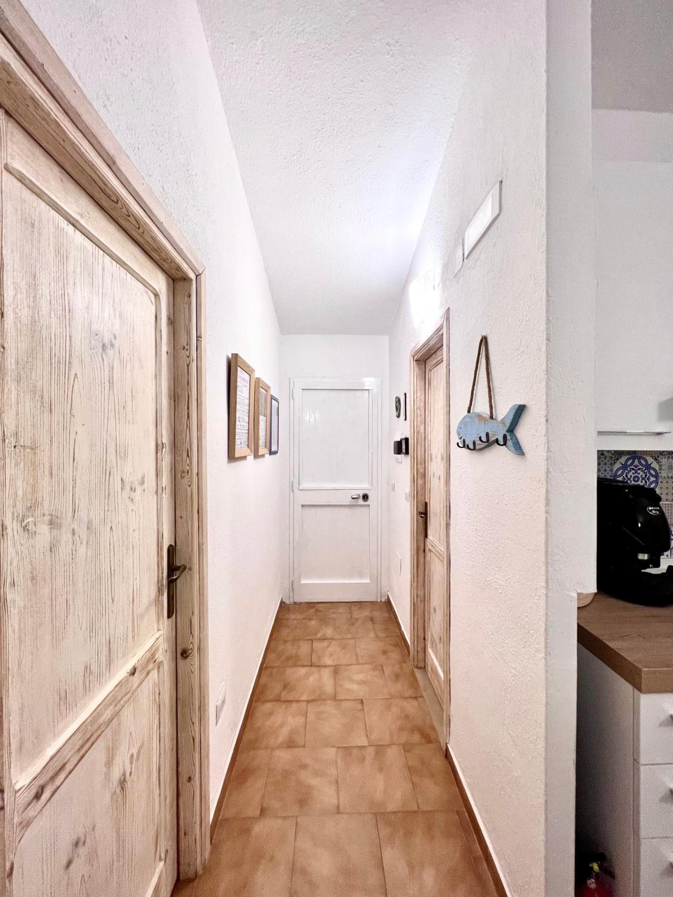DOMUS HENRICUS -THREEROOM APARTMENT IN PORTO POLLO 400 Meters from the sea view 3