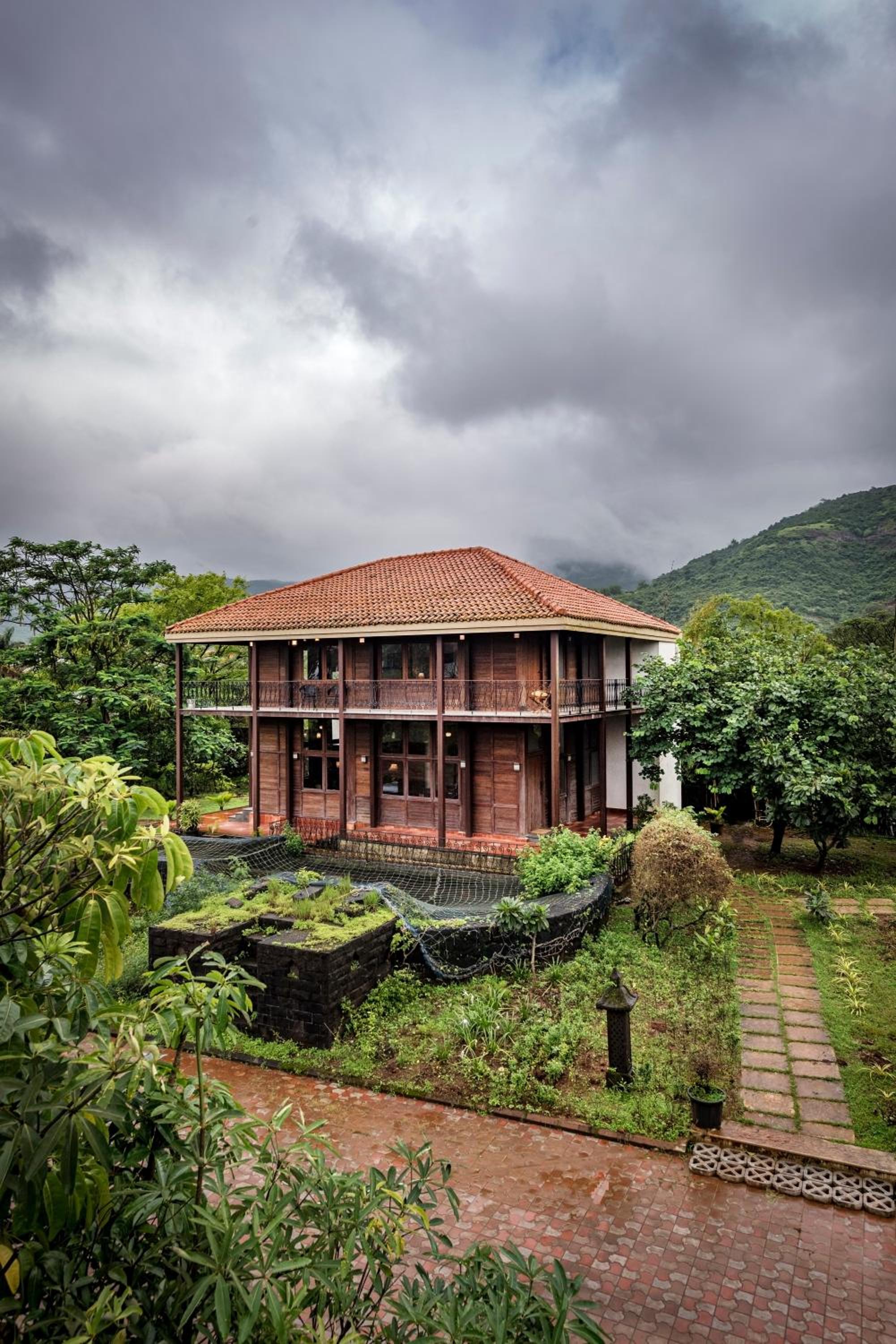 SaffronStays Boulevard LogHouse - a wooden chalet amidst nature view 3