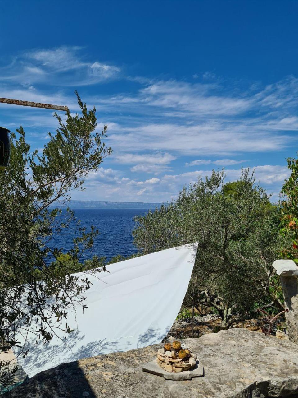 Hotel Cottage Made Of Stones And Wood With The Sea View.