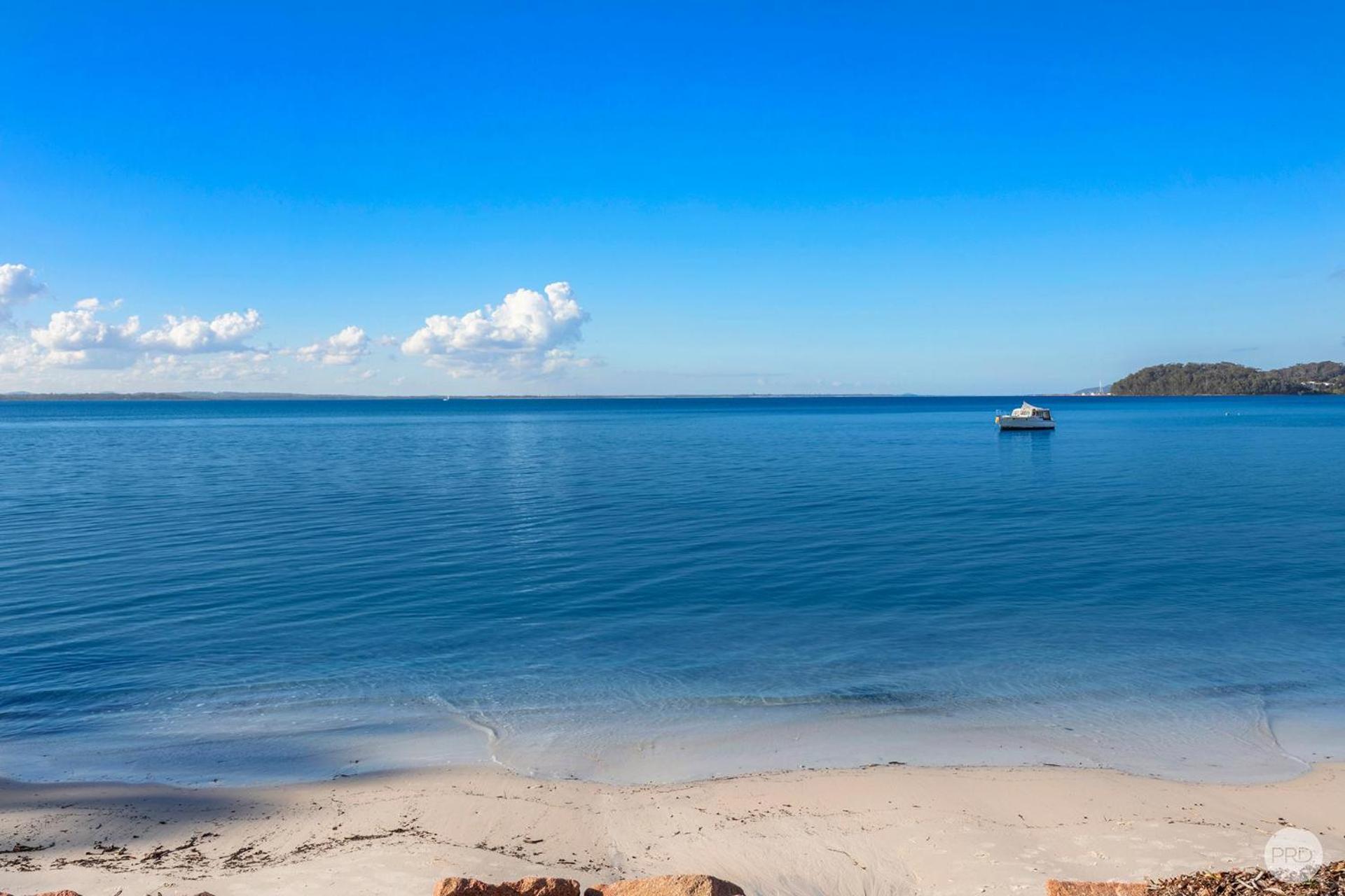 Seaside Sanctuary - Waterfront Luxury Home with Heated Pool