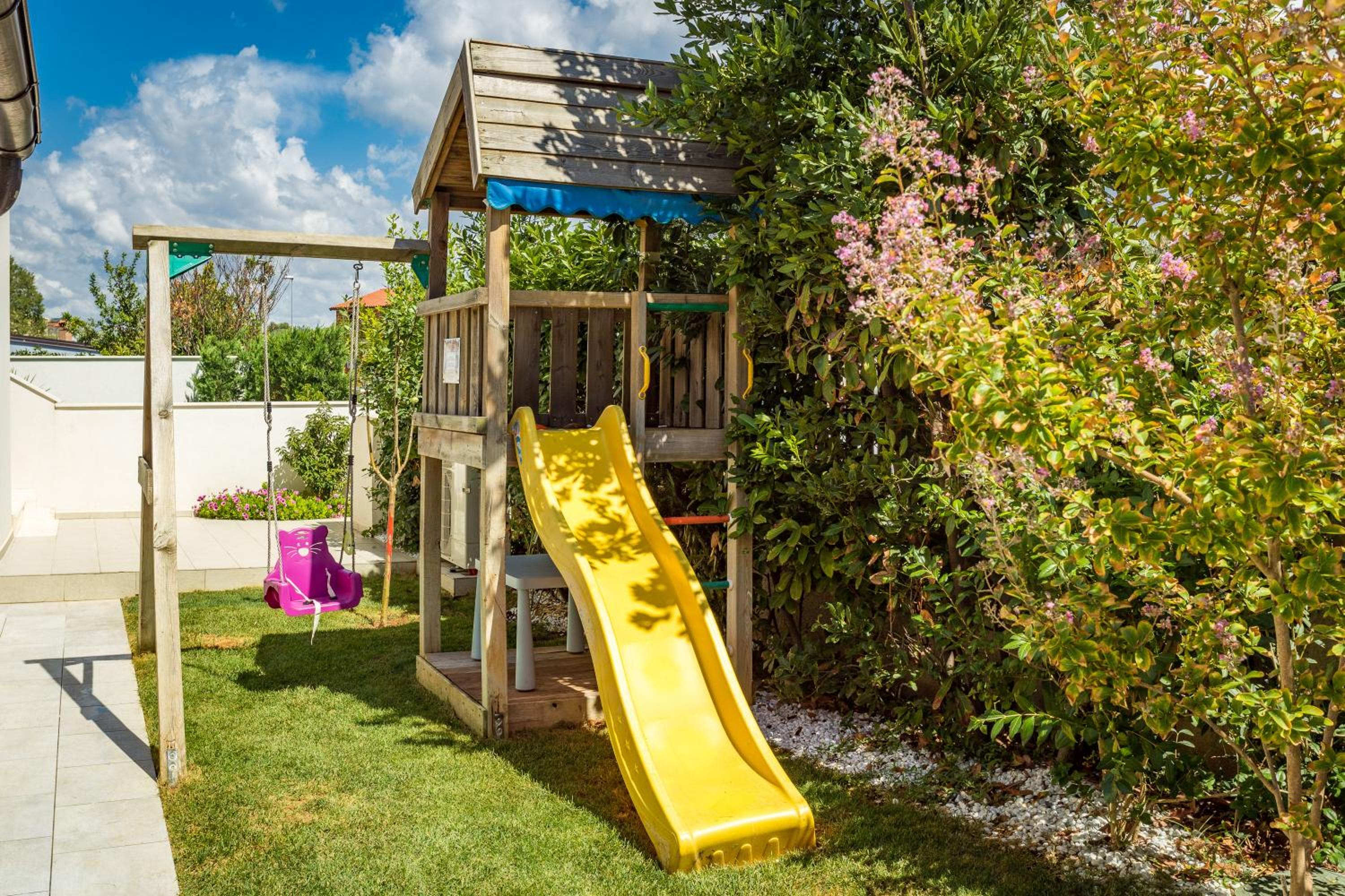 Villa Andrija Family Dream with heated pool at the sea with beautiful garden, outside cinema and kids playground