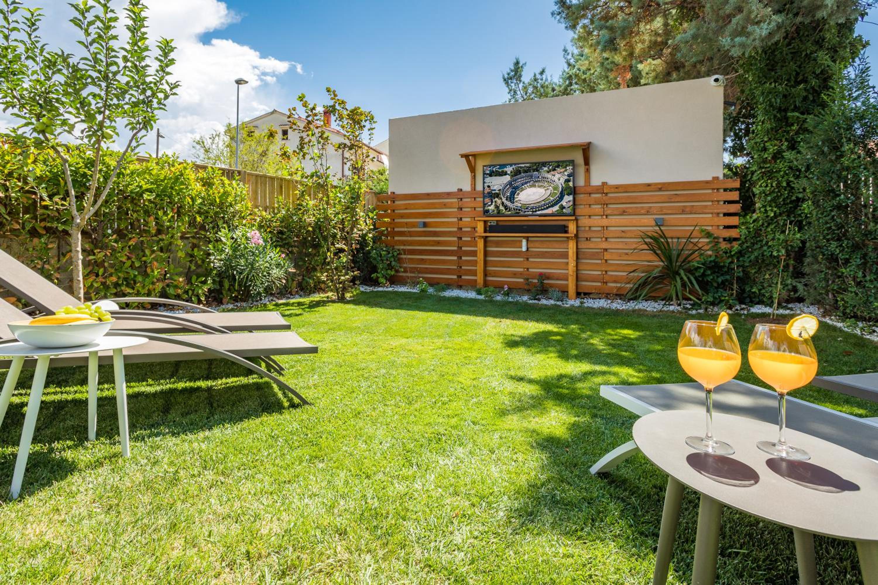 Villa Andrija Family Dream with heated pool at the sea with beautiful garden, outside cinema and kids playground