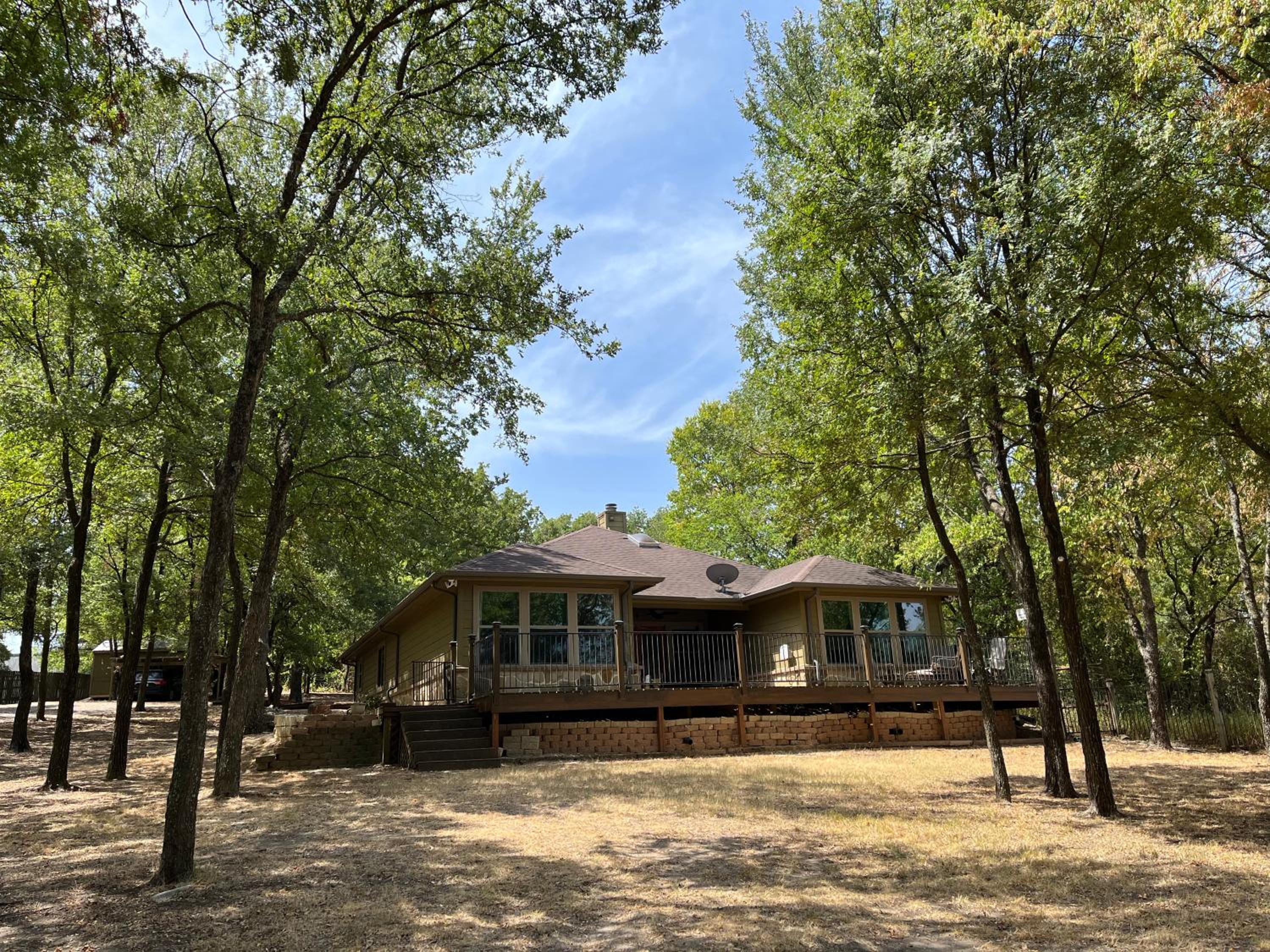 Beautiful lakefront house in private woods view 2