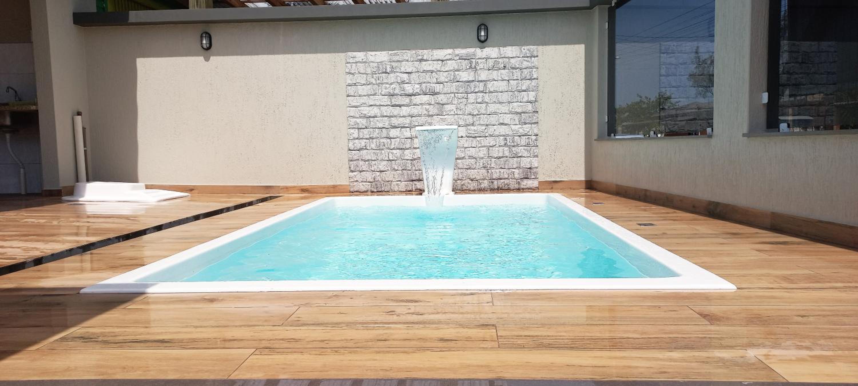 Casa com piscina, Ar condicionado, Pertinho Do Mar Em Capão Da Canoa