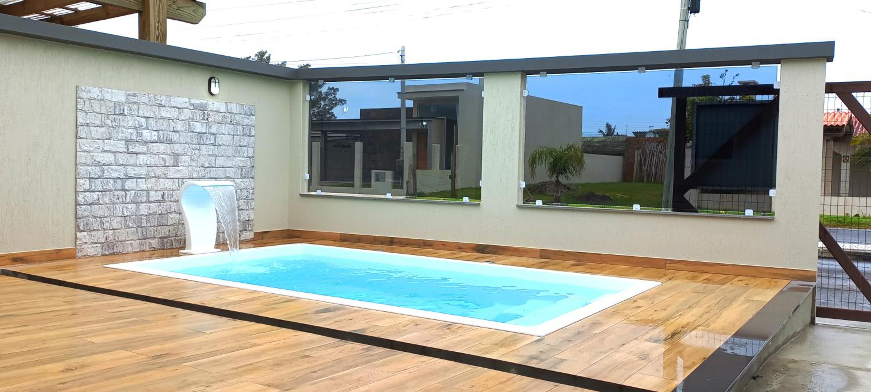 Casa com piscina, Ar condicionado, Pertinho Do Mar Em Capão Da Canoa