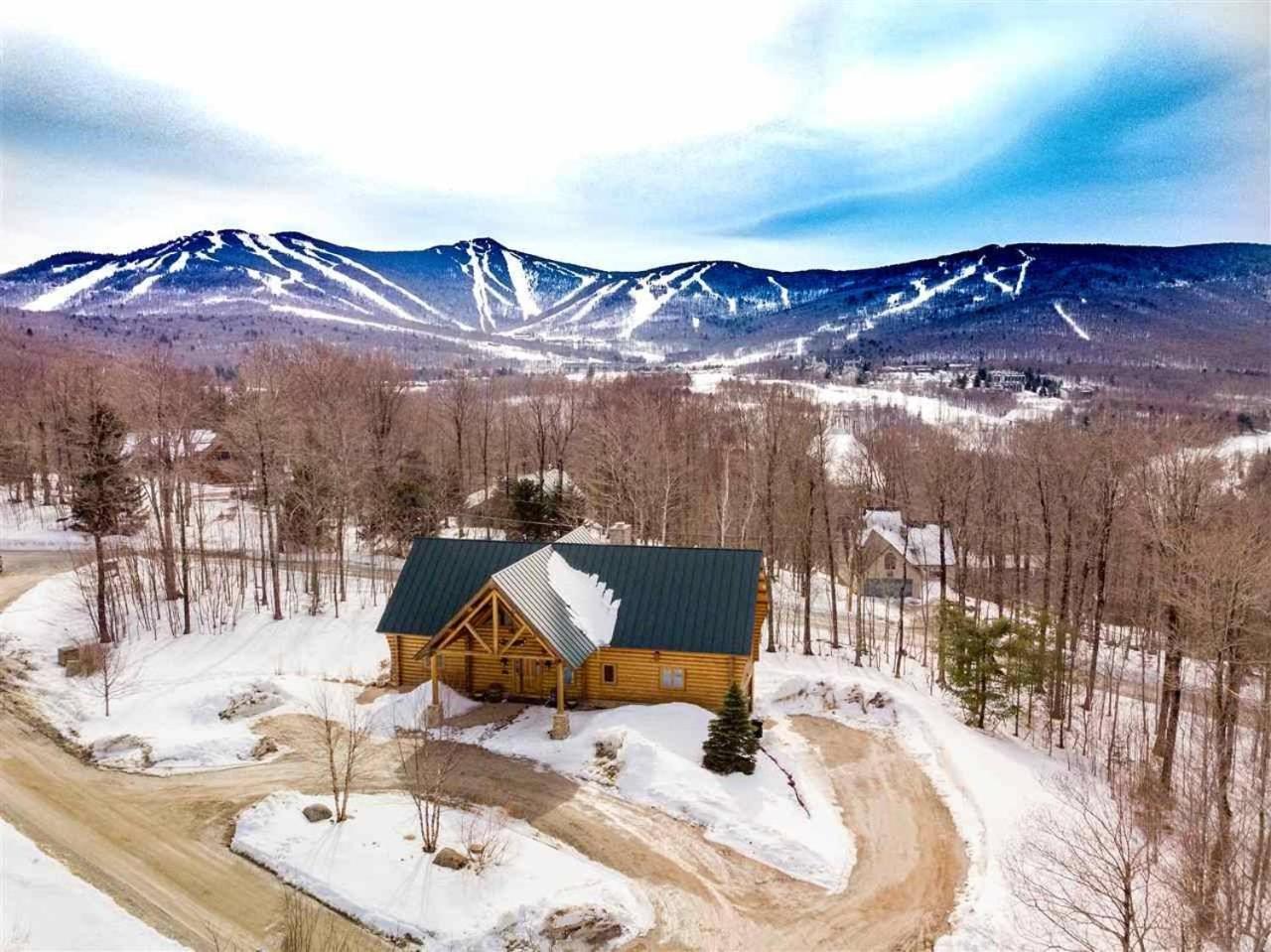 Enjoy this stunning Log home with open floor plan and tons of natural lighting Ridgetop view 2