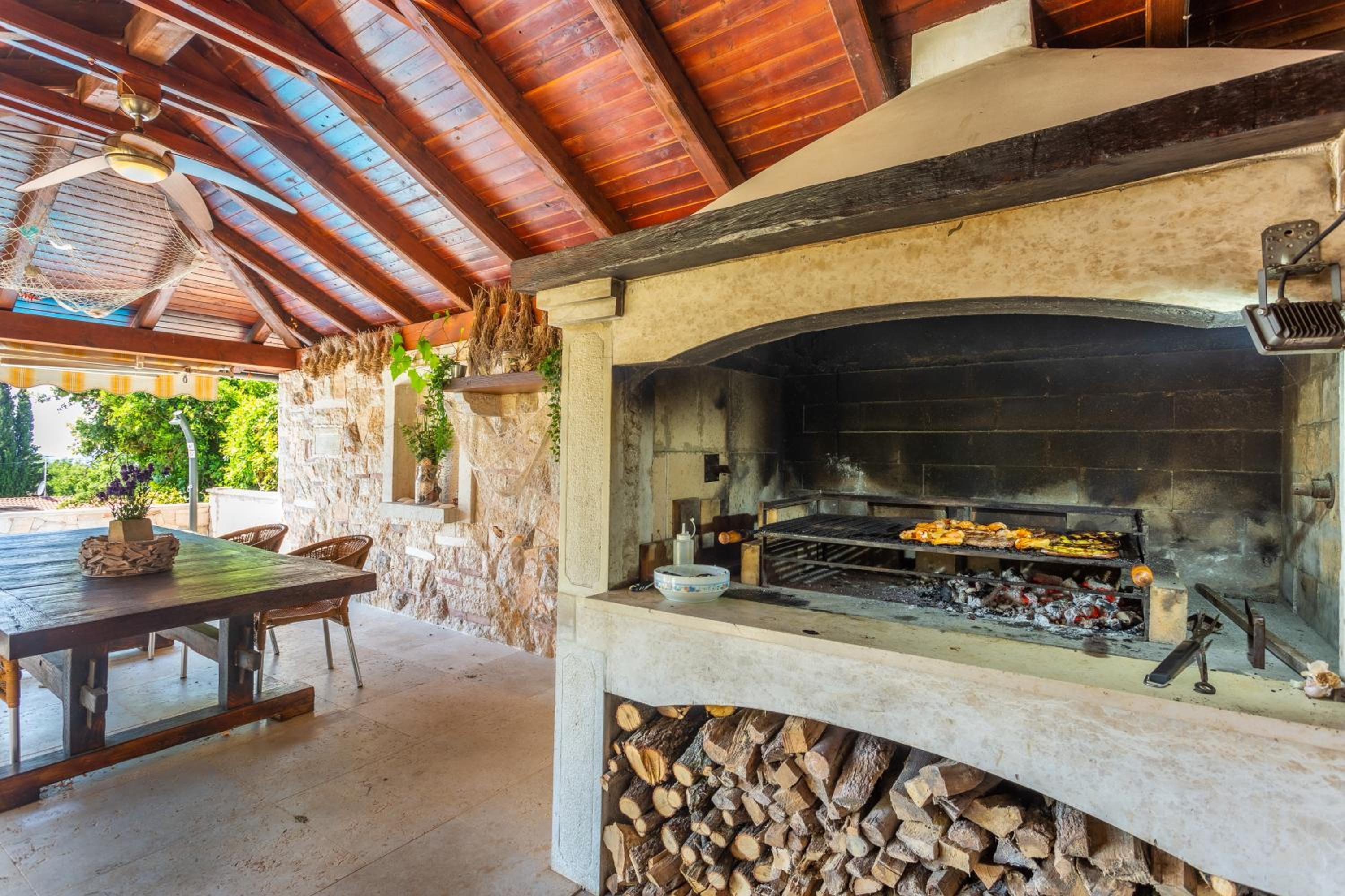 Mediterranean terrace with bbq, swimming pool and sea view