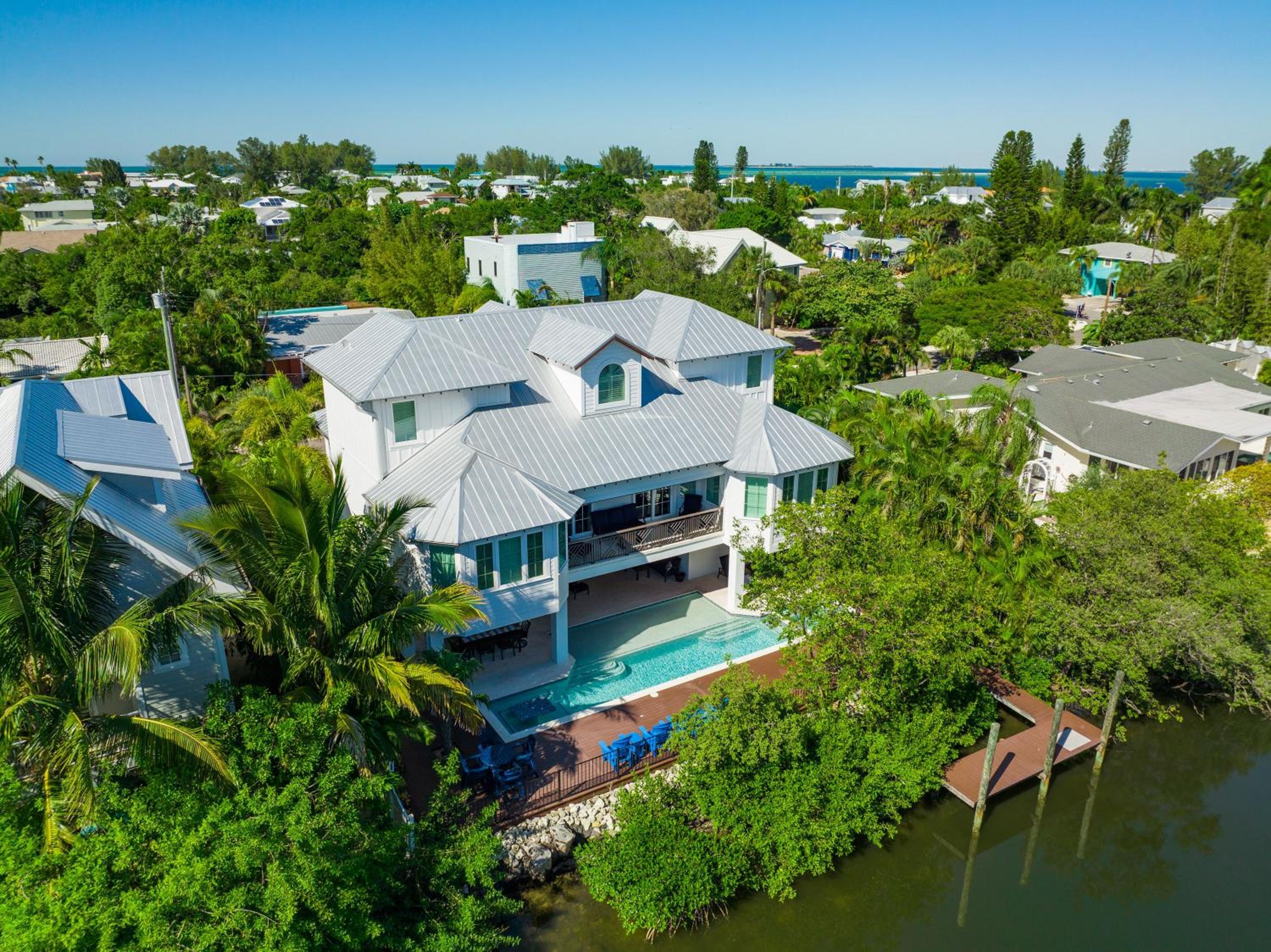 Tern Key - New Luxury Canal Front Home with Pool Spa Dock Close to Bean Point Pine Ave view 4