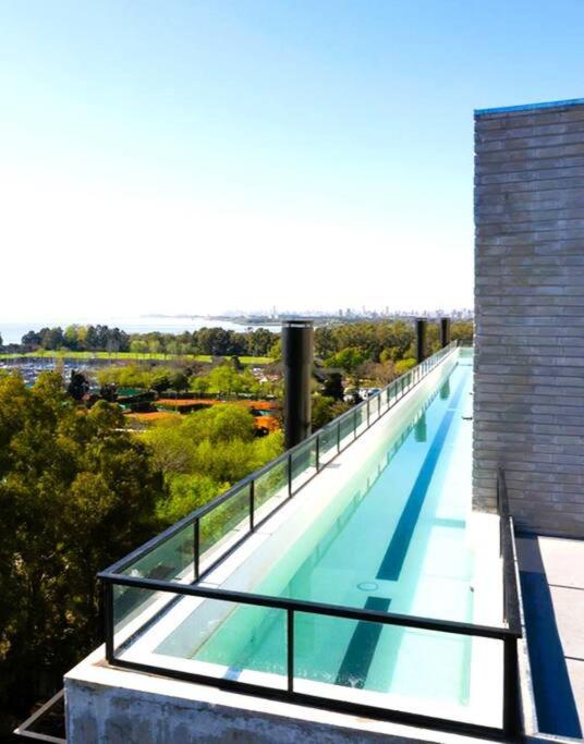 Stylish Apartment by River with Pool & Grill