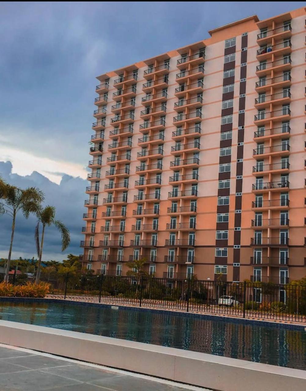 Dracarys 1 Condo Stay with pool balcony & kitchen view 5