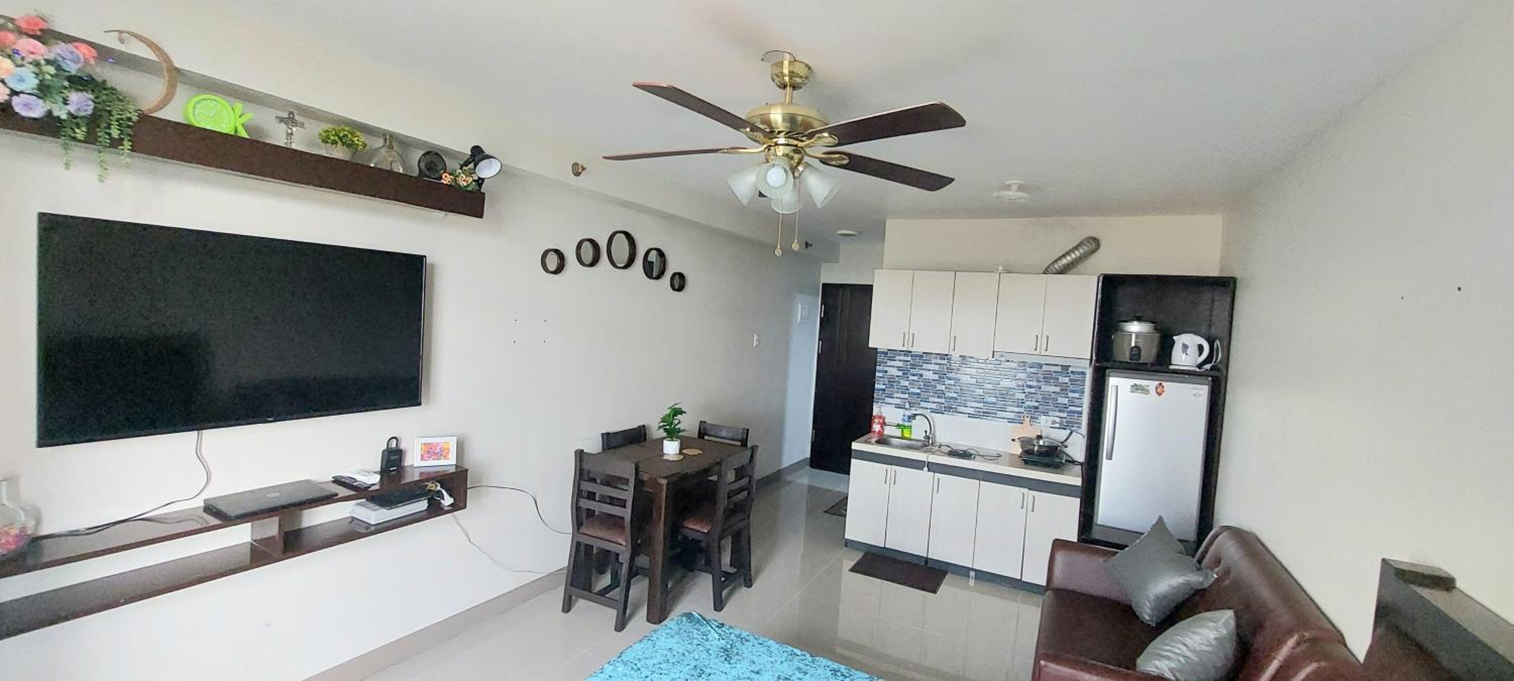Dracarys 1 Condo Stay with pool balcony & kitchen view 2