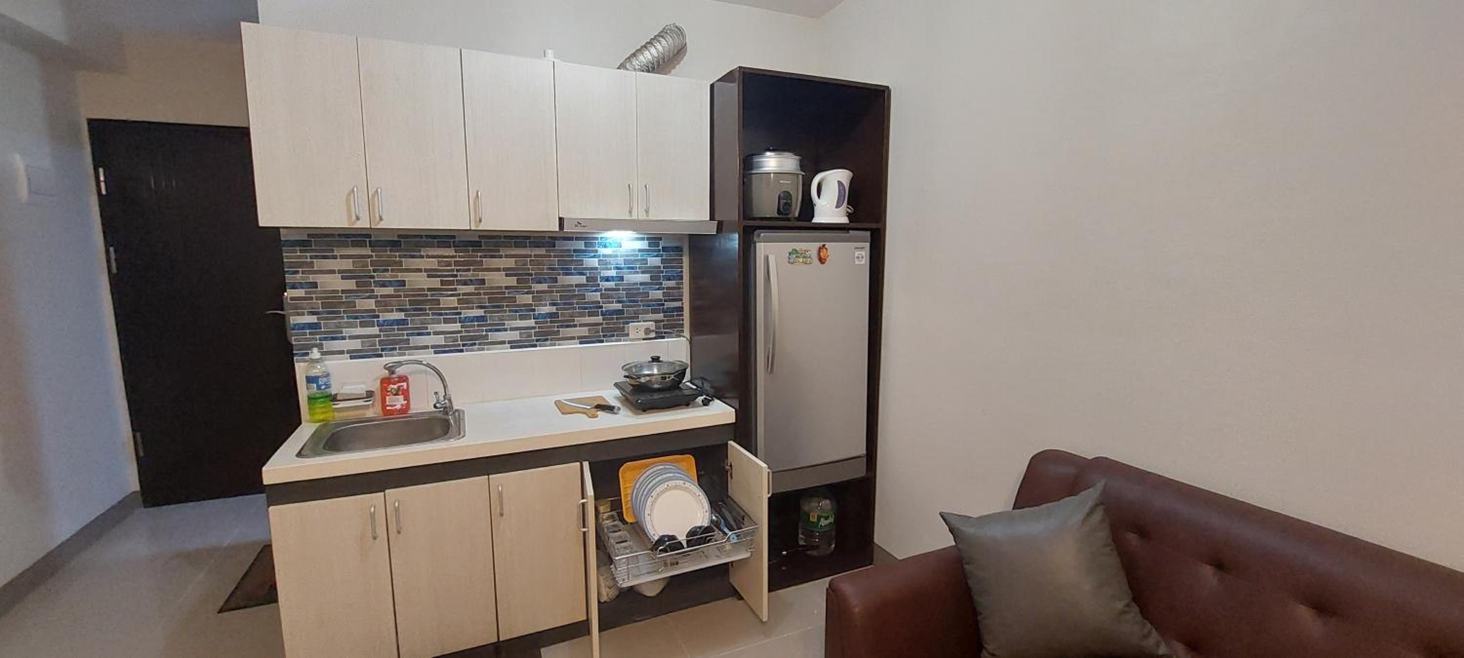 Dracarys 1 Condo Stay with pool balcony & kitchen view 3