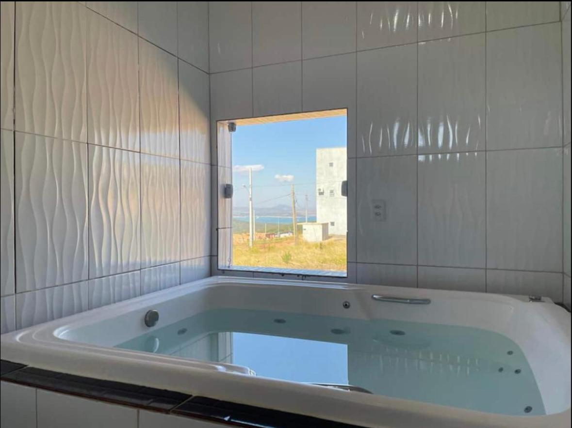 Casa com piscina Capitólio