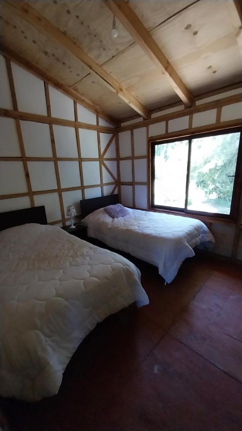Cabaña a orilla del río Liucura