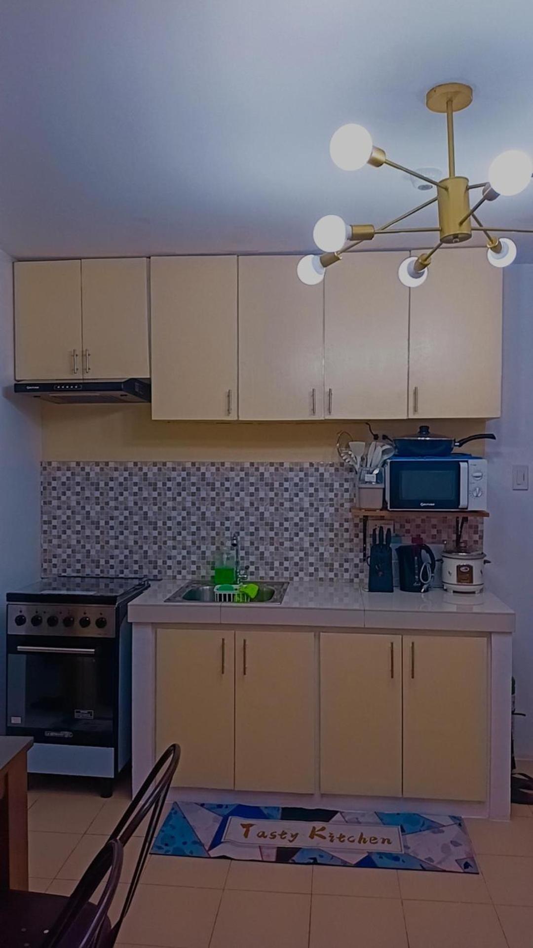 One Spatial Two Bedroom Condominium Unit with Pool and Gym free Netflix and wifi view 5