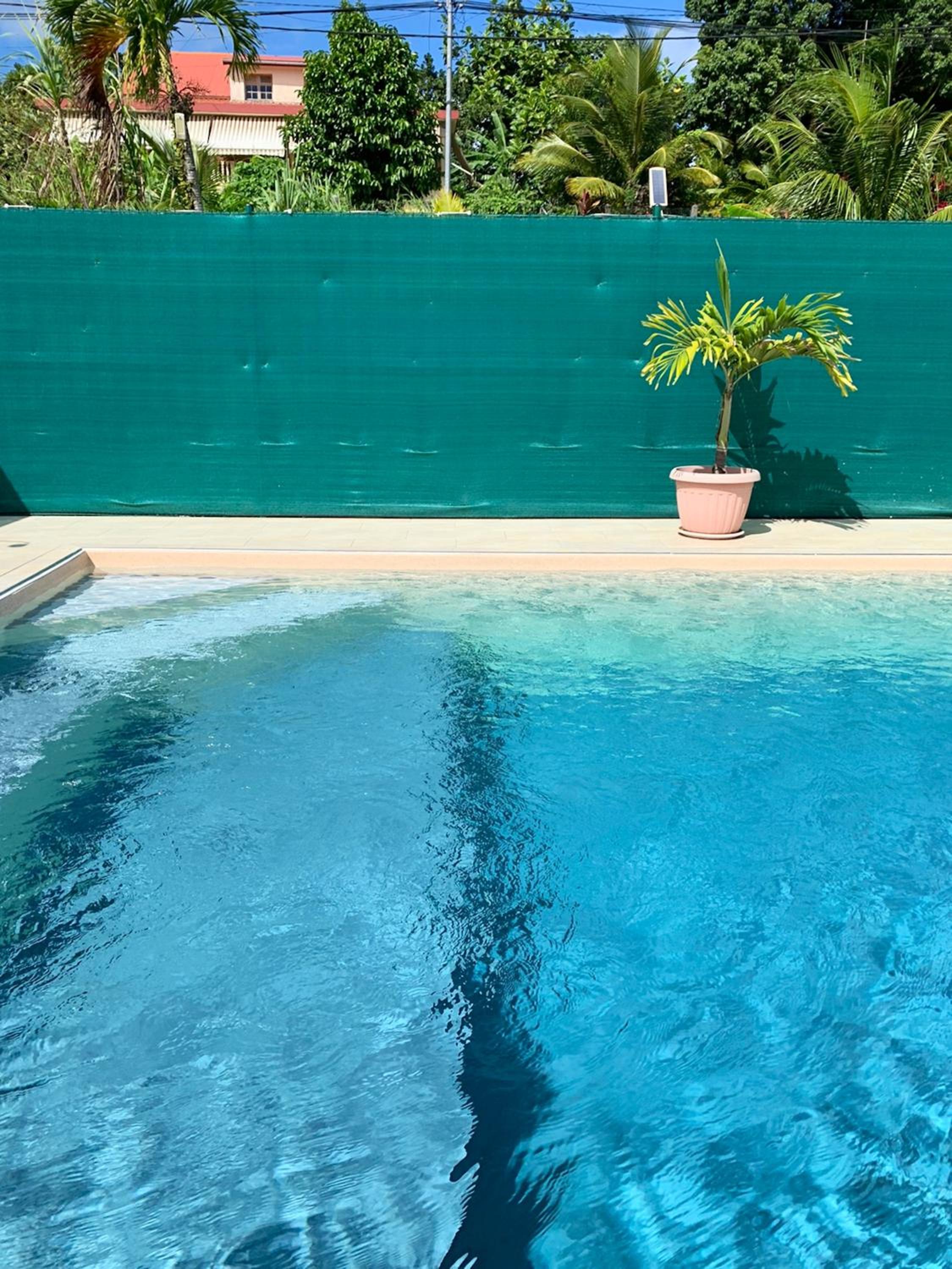 Maison charmante à Petit-Bourg avec piscine partagée