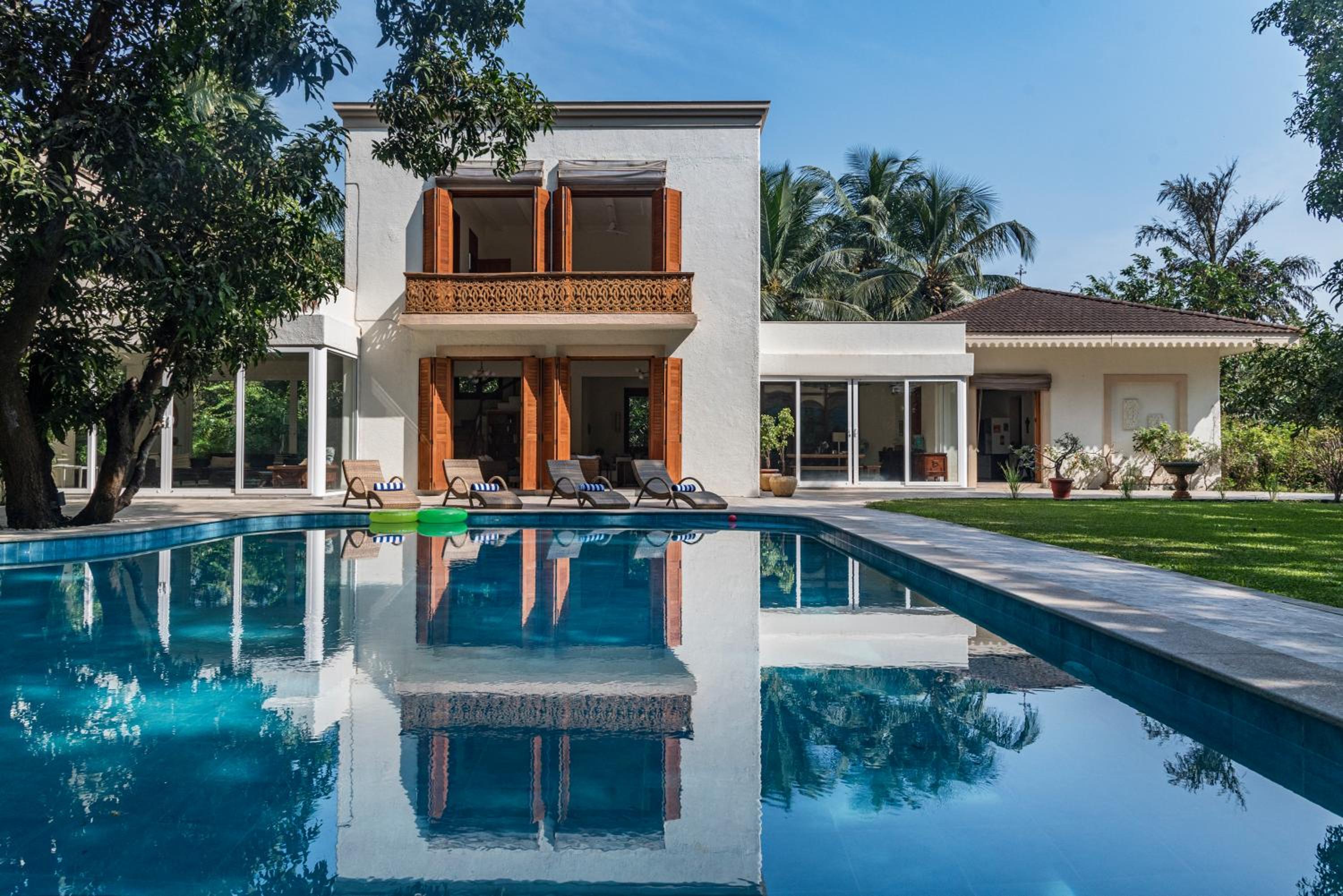 SaffronStays Hacienda by the Sea - 5BR Spanish-style pet & elder-friendly pool villa with lawns, beach access & BBQ nights
