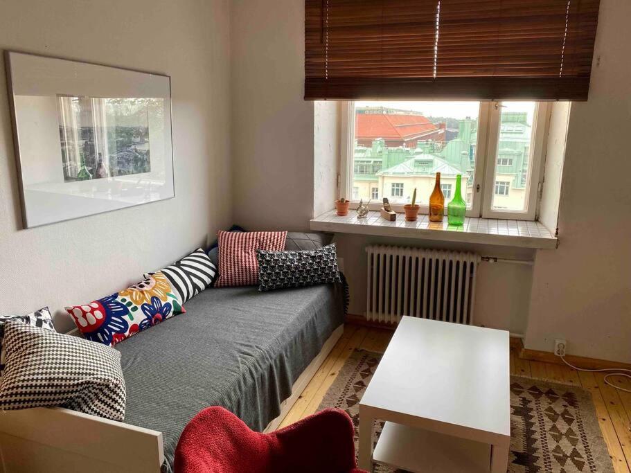 Studio apartment, view over the roofs for the sunrise
