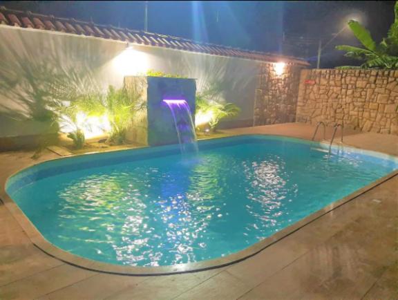 Casa na praia com piscina, churrasqueira e sinucão