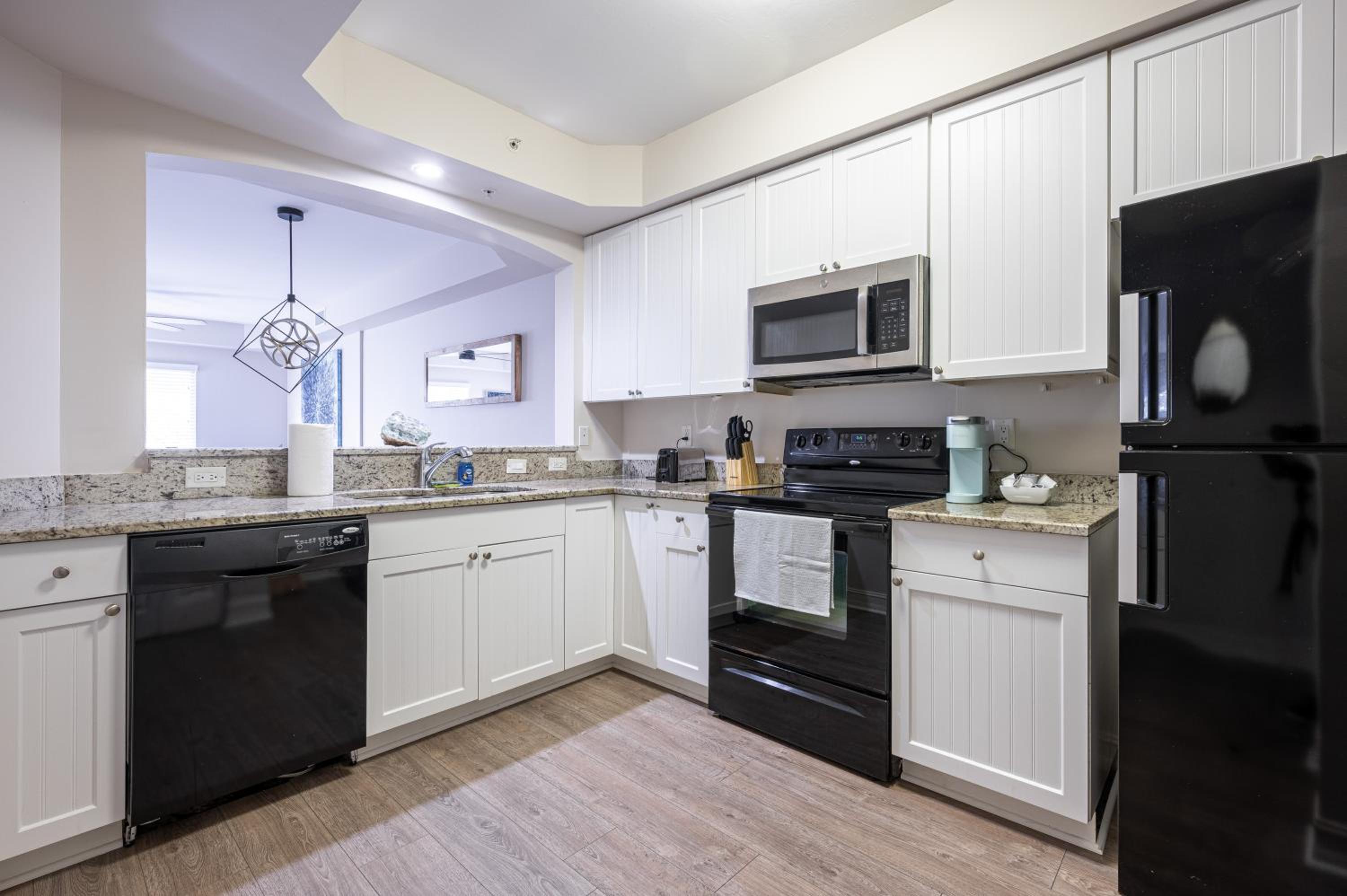 Updated Beach Condo! Facing Heated Pool & Sunset! view 3