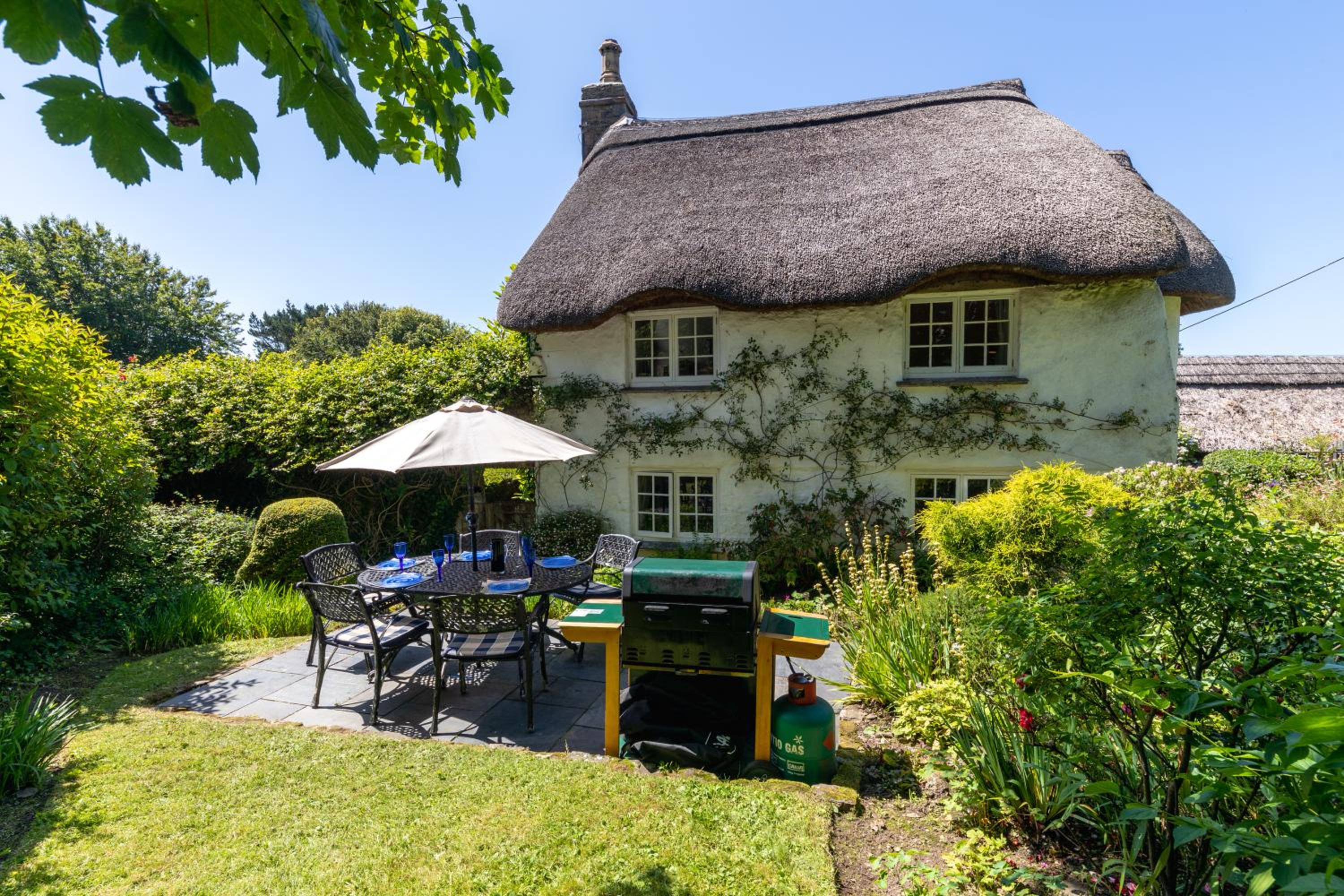 Putsborough Manor - 3 Self Catering Cottages Our Beach is dog friendly all year! On site Tennis & Play Area Paddock Spa baths Gas BBQs Private Gardens Supe view 3