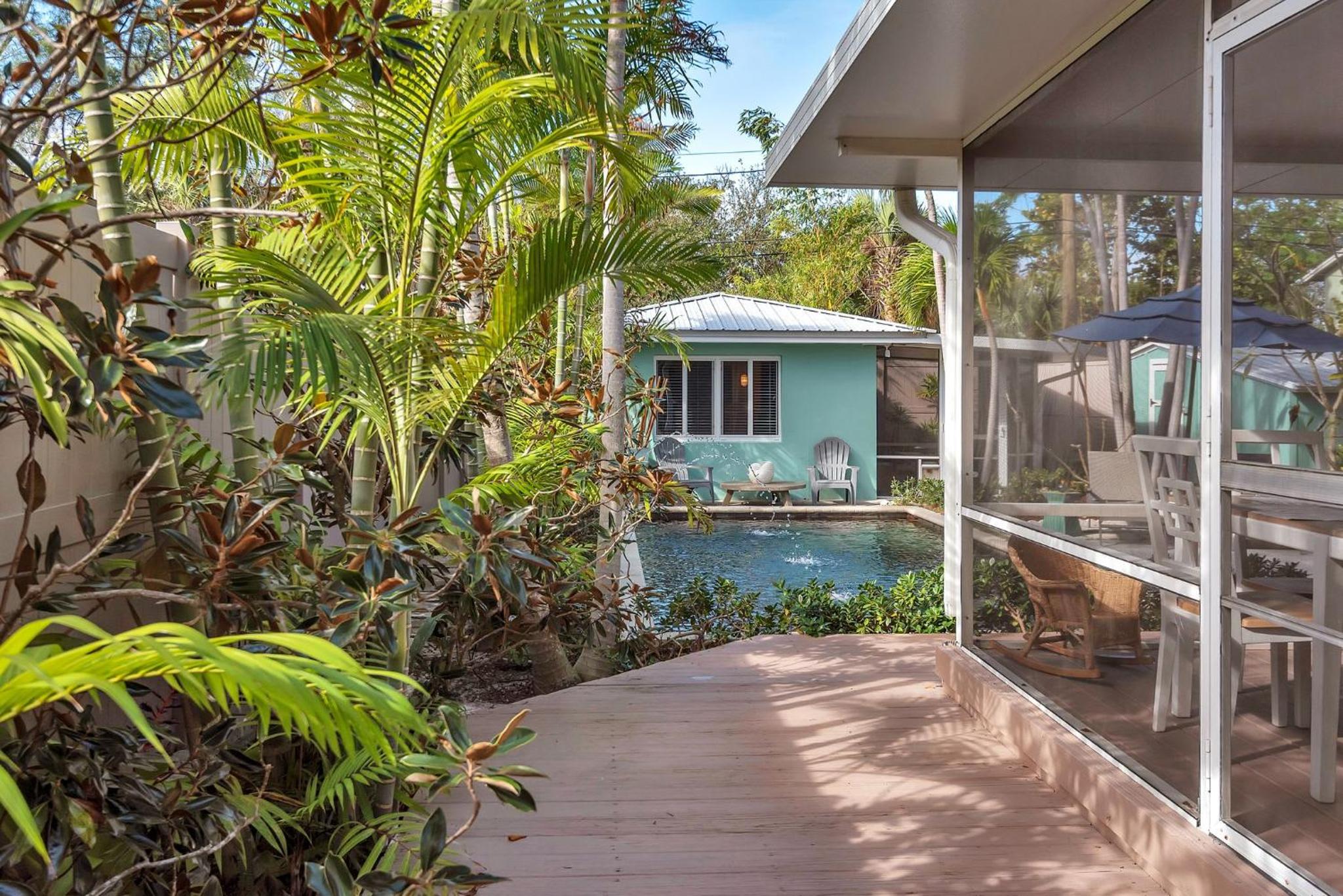 Art Deco Pool house mile and a half to beach Pets Welcome view 5
